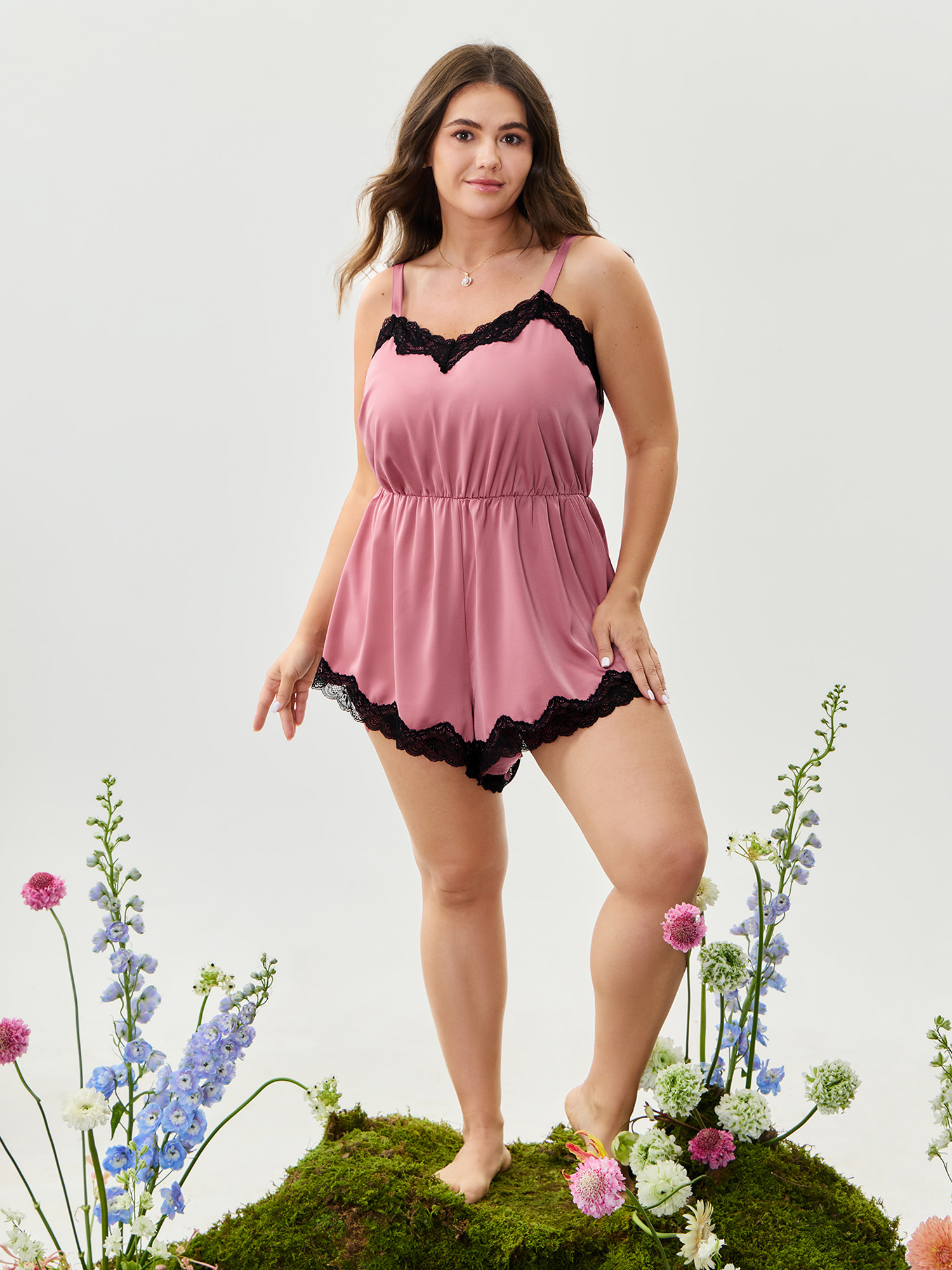 Side view of BloomChic Women's Plus Size Satin Lace Trim Color Contrast Pajama Romper Watermelon Solid V-Neck Pajama Jumpsuits 12/L