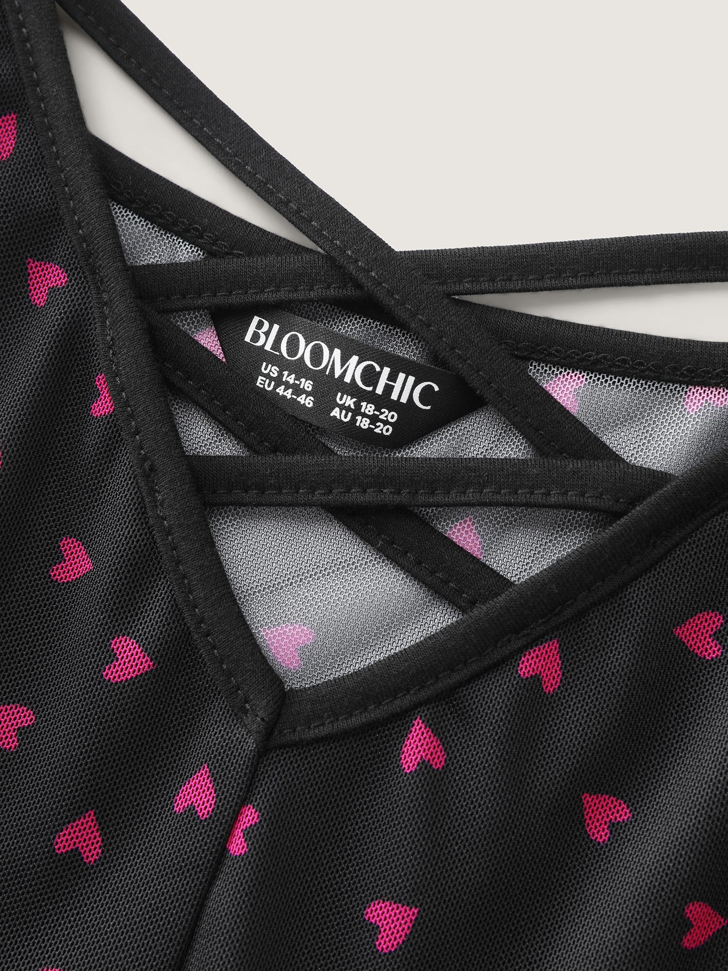 Side view of BloomChic Women's Plus Size Sweetheart Print Sheer Crisscross Neckline Nightgown Black Sleeveless Tunic 12/L