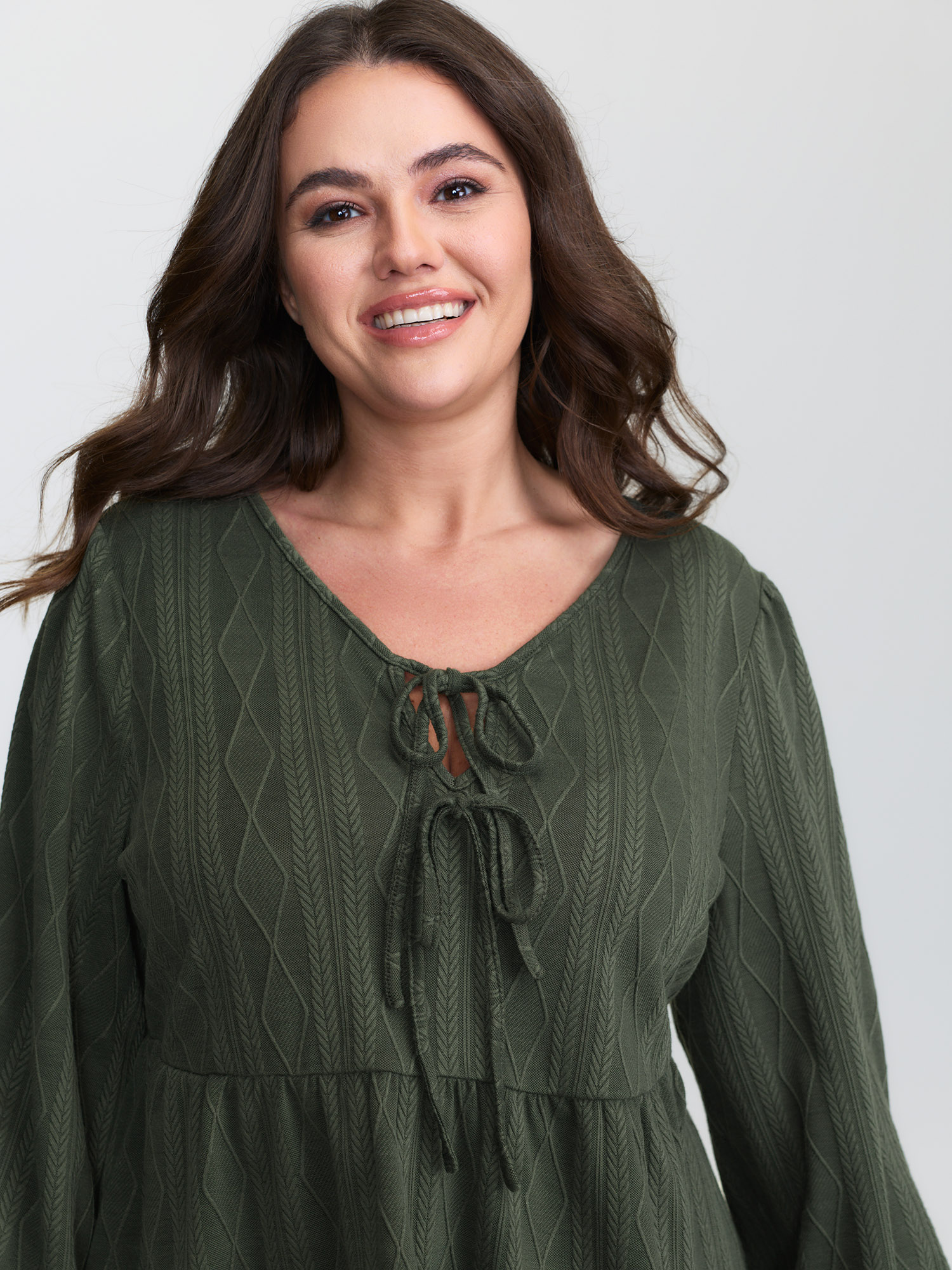 Side view of BloomChic Women's Plus Size Textured Front-Tie Relaxed-Fit Lounge Set ArmyGreen Solid Long Sleeve Lace-Up 30/6X