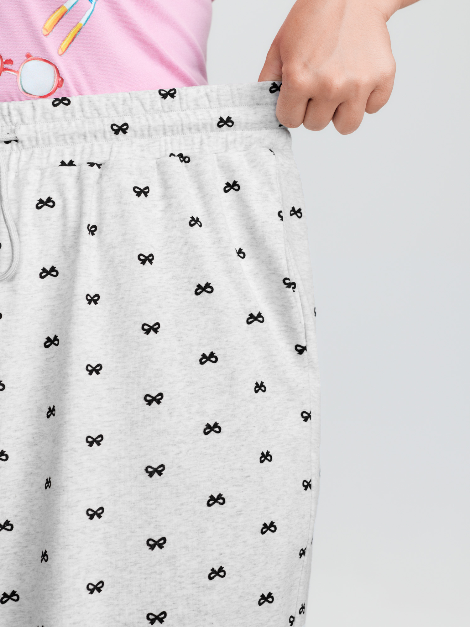 Side view of BloomChic Women's Plus Size Cotton Polka Dots Heather Drawstring Lounge Pants LightGray 28/5X