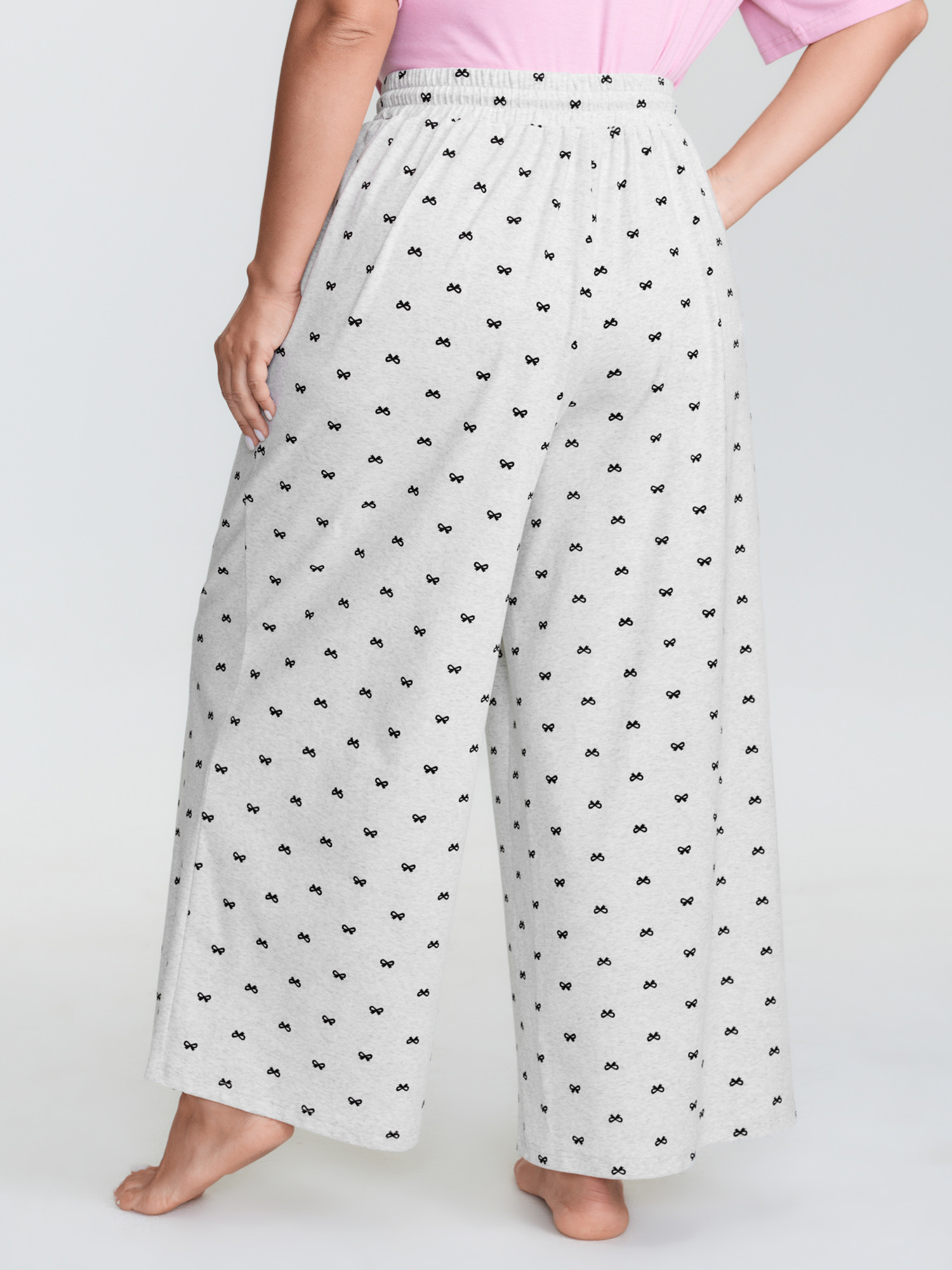 Side view of BloomChic Women's Plus Size Cotton Polka Dots Heather Drawstring Lounge Pants LightGray 28/5X