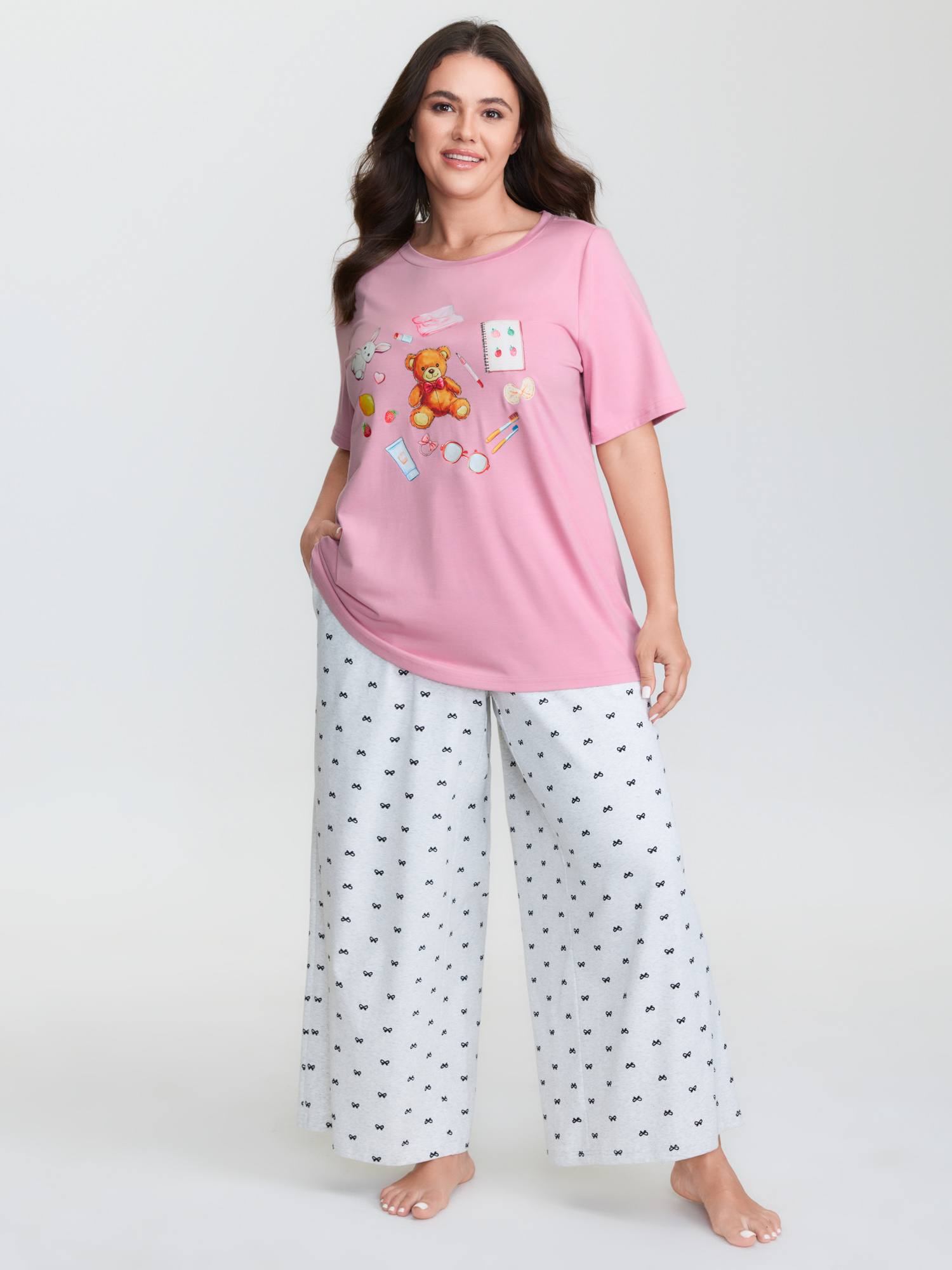 Side view of BloomChic Women's Plus Size Teddy Bear Graphic Print Pajama Top Beanpastepowder Naive Art Short sleeve Round Neck 10/M