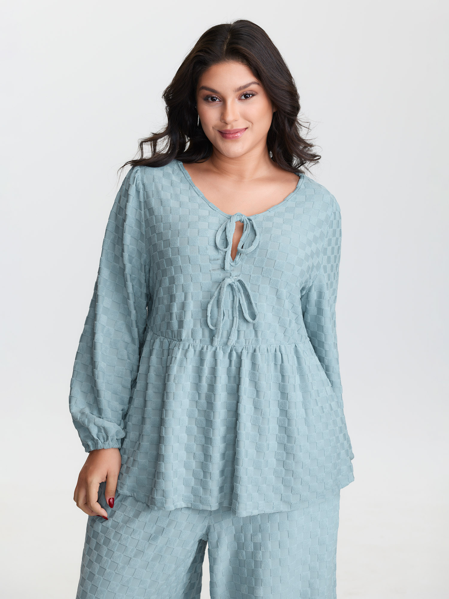 Side view of BloomChic Women's Plus Size Checkered Textured Co-ord Lounge Set LightBlue Solid Long Sleeve Smocked 22-24/3X