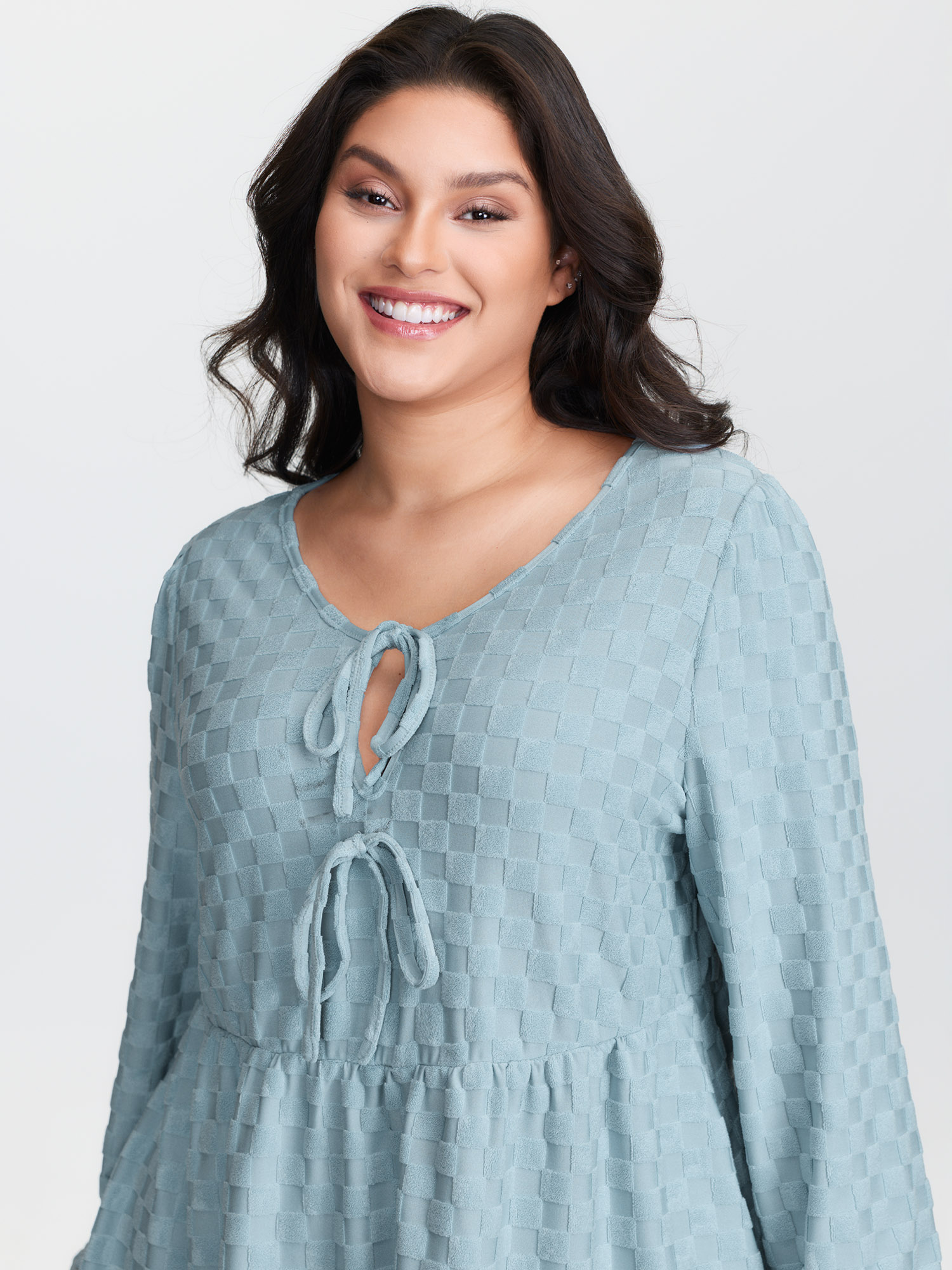 Side view of BloomChic Women's Plus Size Checkered Textured Co-ord Lounge Set LightBlue Solid Long Sleeve Smocked 22-24/3X