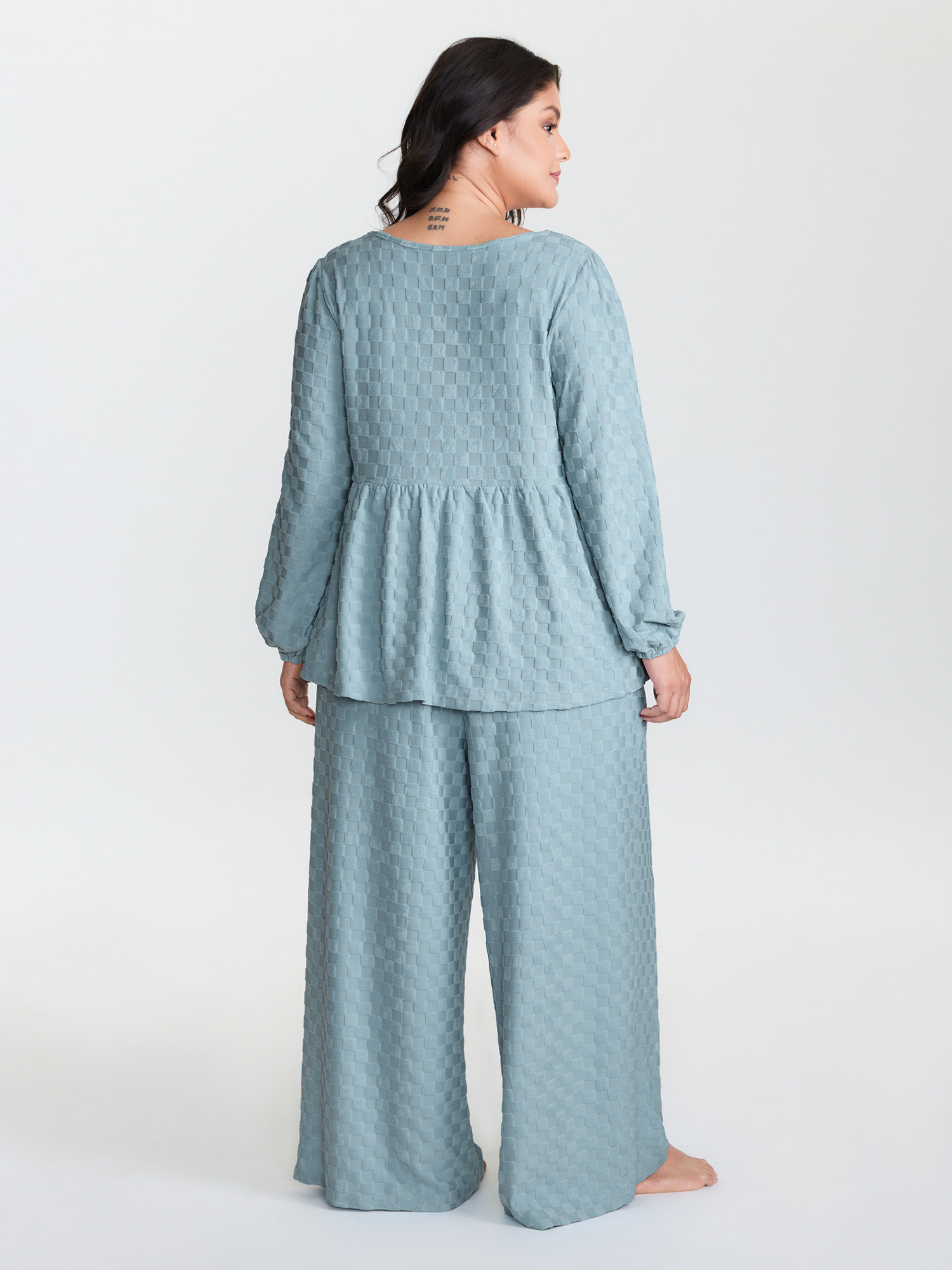 Side view of BloomChic Women's Plus Size Checkered Textured Co-ord Lounge Set LightBlue Solid Long Sleeve Smocked 22-24/3X