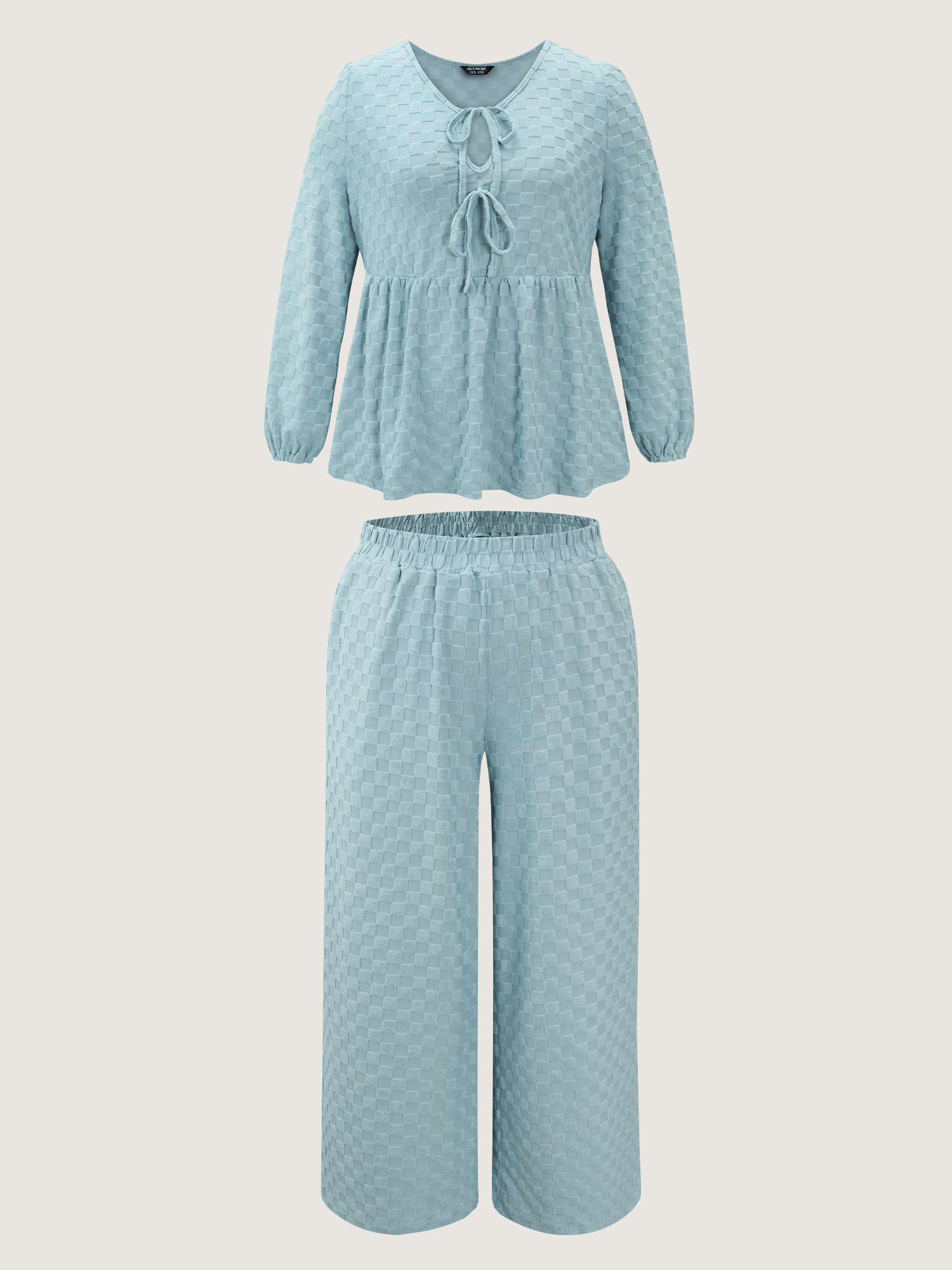Side view of BloomChic Women's Plus Size Checkered Textured Co-ord Lounge Set LightBlue Solid Long Sleeve Smocked 22-24/3X