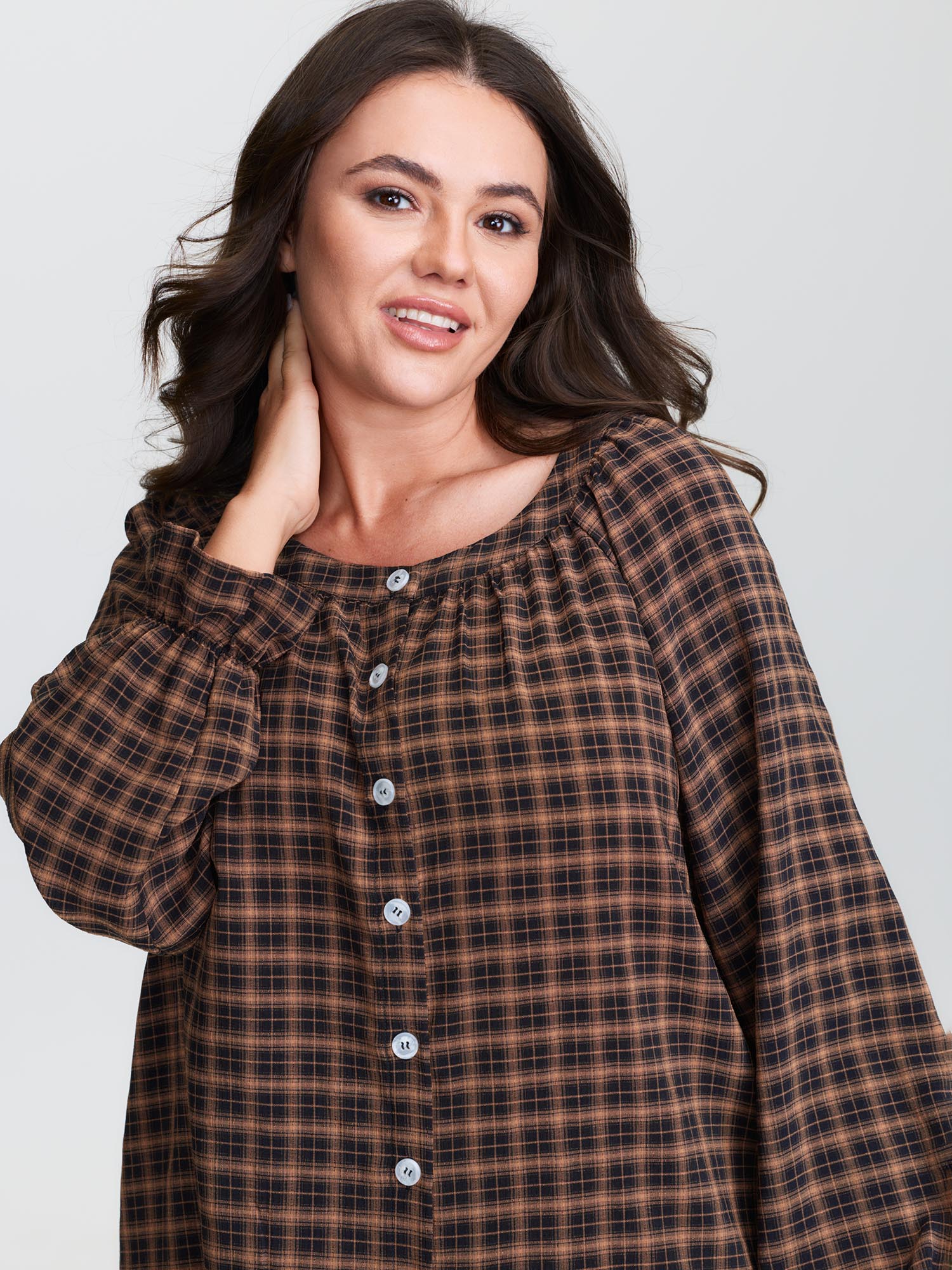 Side view of BloomChic Women's Plus Size Gingham Print Ruffled Hem Co-Ord Pajama Set Rust not graphics 28/5X
