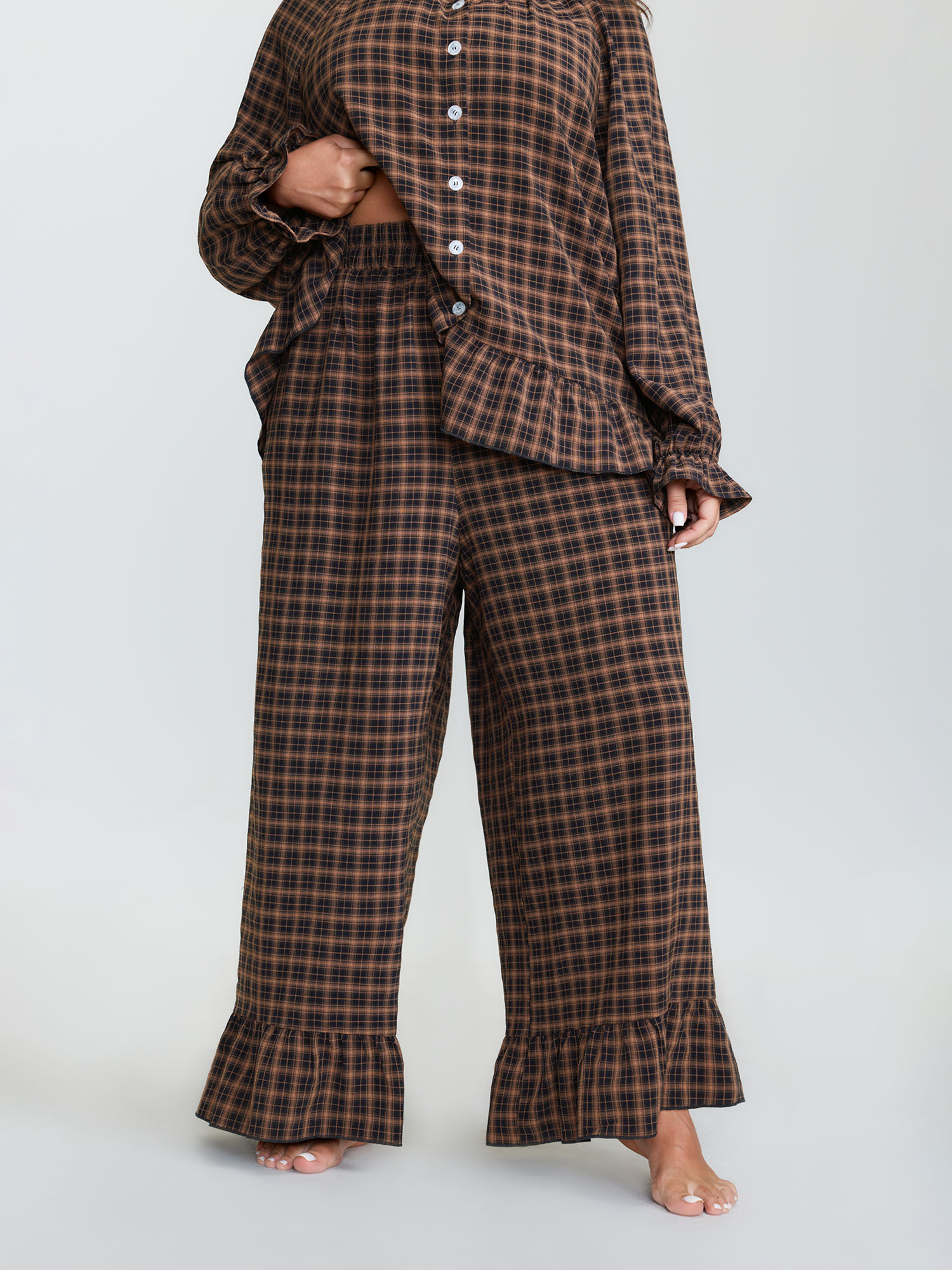 Side view of BloomChic Women's Plus Size Gingham Print Ruffled Hem Co-Ord Pajama Set Rust not graphics 28/5X