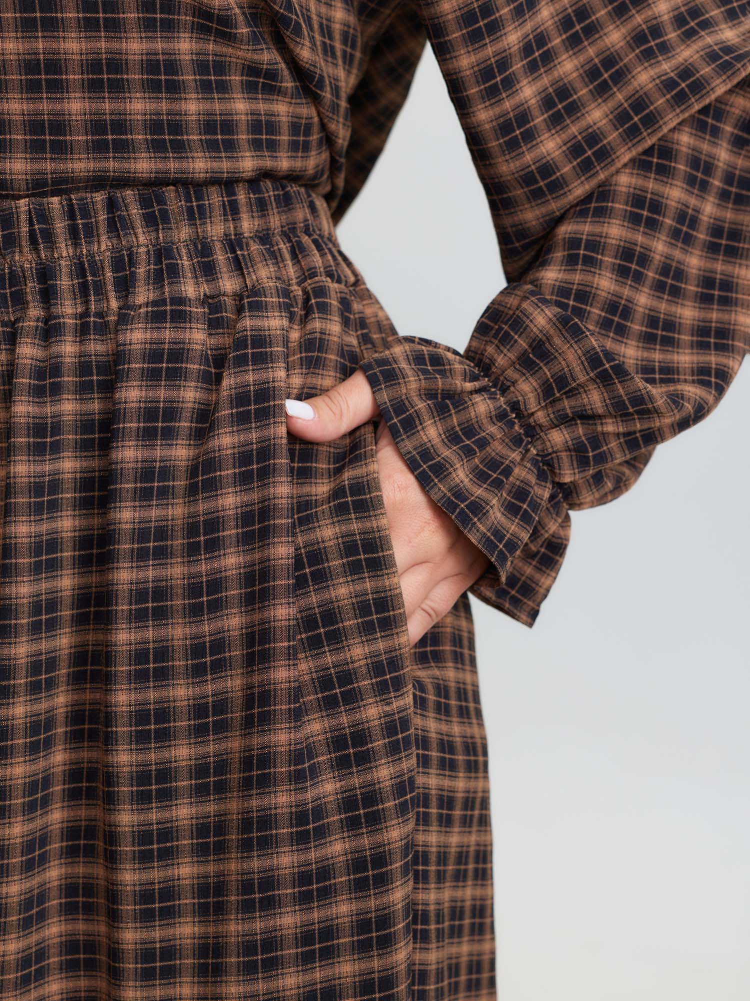 Side view of BloomChic Women's Plus Size Gingham Print Ruffled Hem Co-Ord Pajama Set Rust not graphics 28/5X