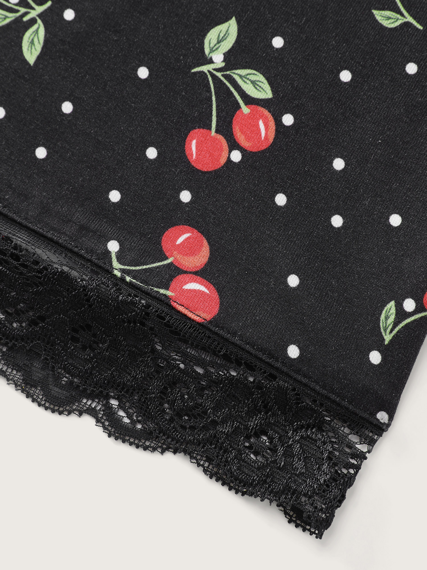 Side view of BloomChic Women's Plus Size Supersoft Cherry Print Lace Pockets Pajama Set Black not graphics 12/L