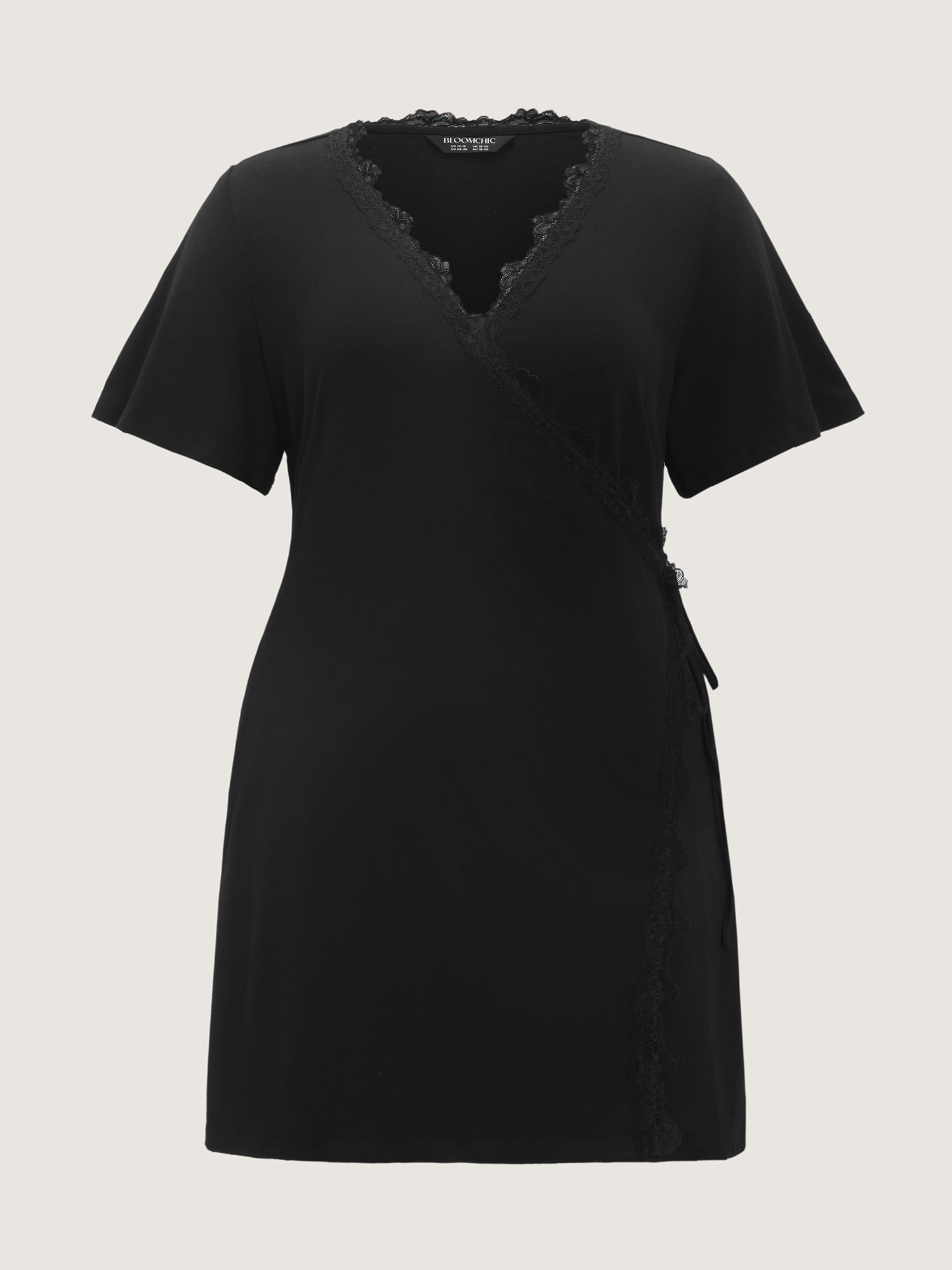 Side view of BloomChic Women's Plus Size Lace Trim Side-Tie Pockets Nightgown Black Short sleeve Mini V-Neck 30/6X