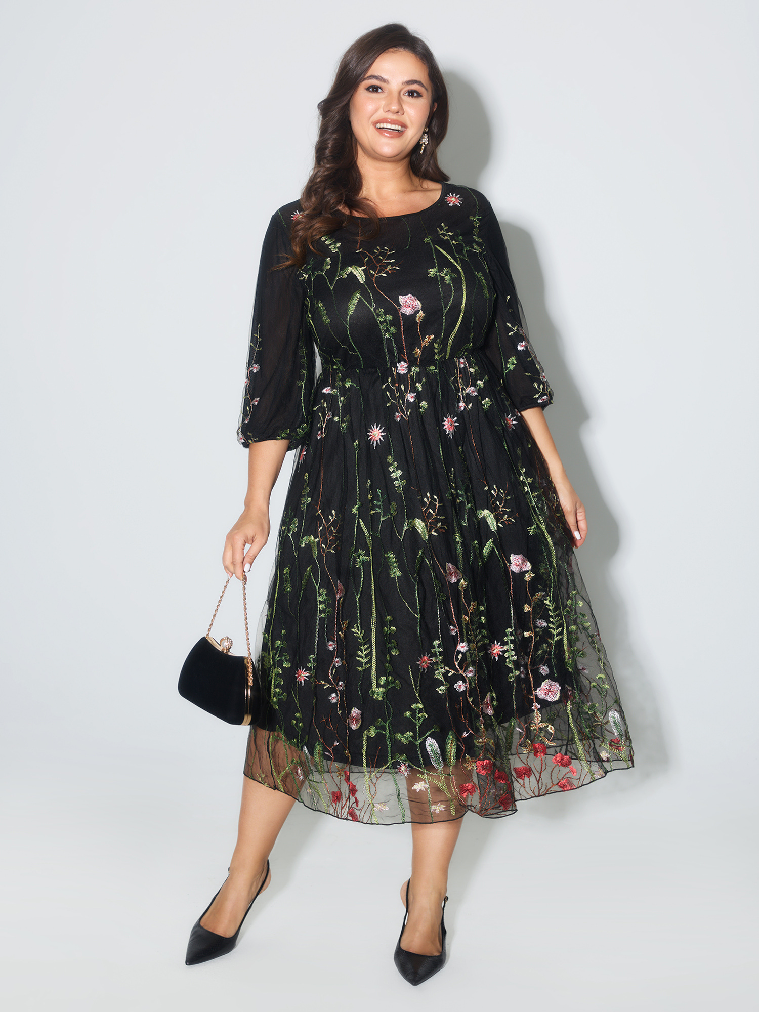 Side view of BloomChic Women's Plus Size Floral Embroidered Elastic Waist Lined Midi Dress Black Party Midi Mesh Panel Round Neck 12/L