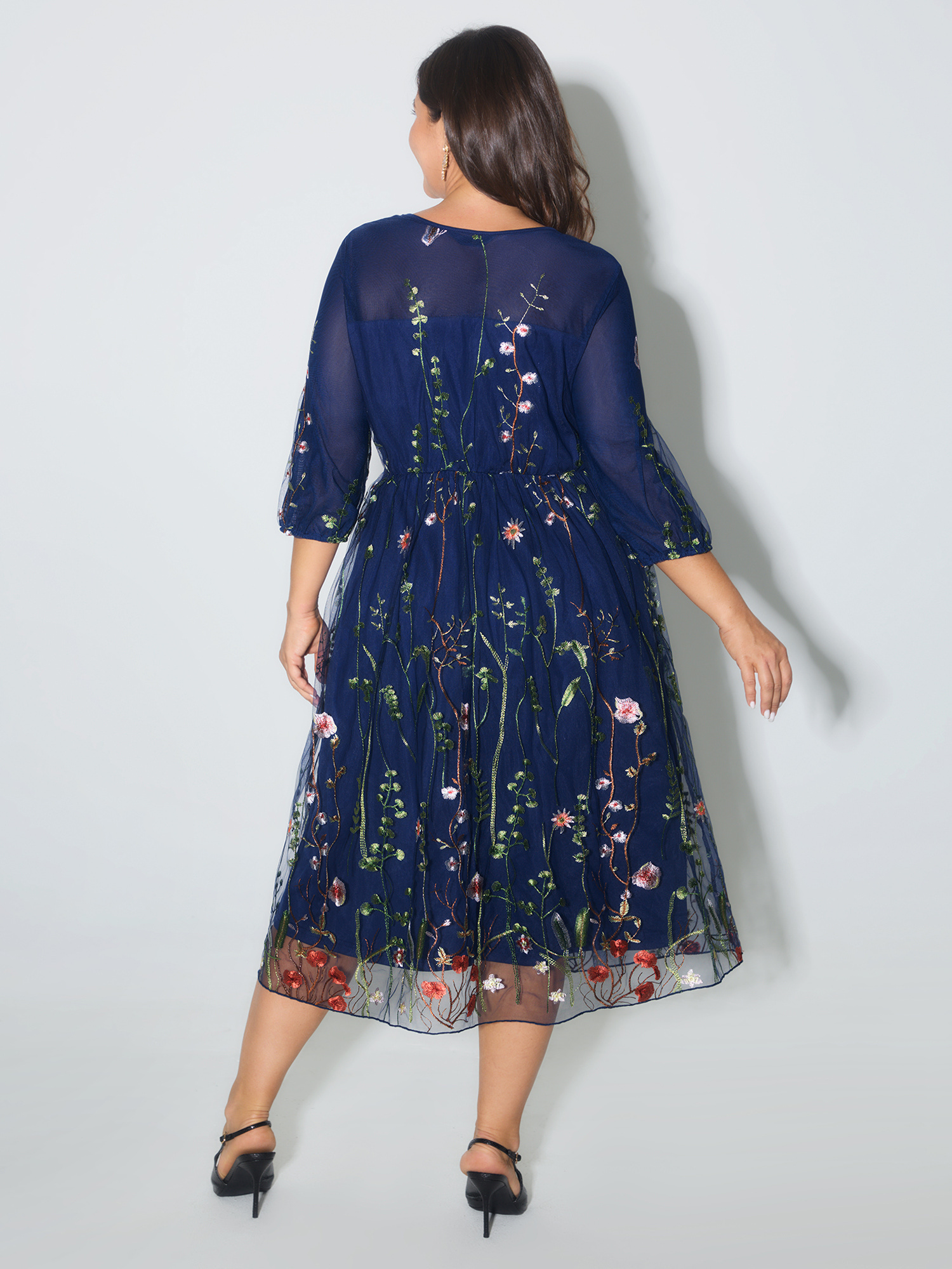 Side view of BloomChic Women's Plus Size Floral Embroidered Elastic Waist Lined Midi Dress Navy Party Midi Mesh Panel Round Neck 18-20/2X