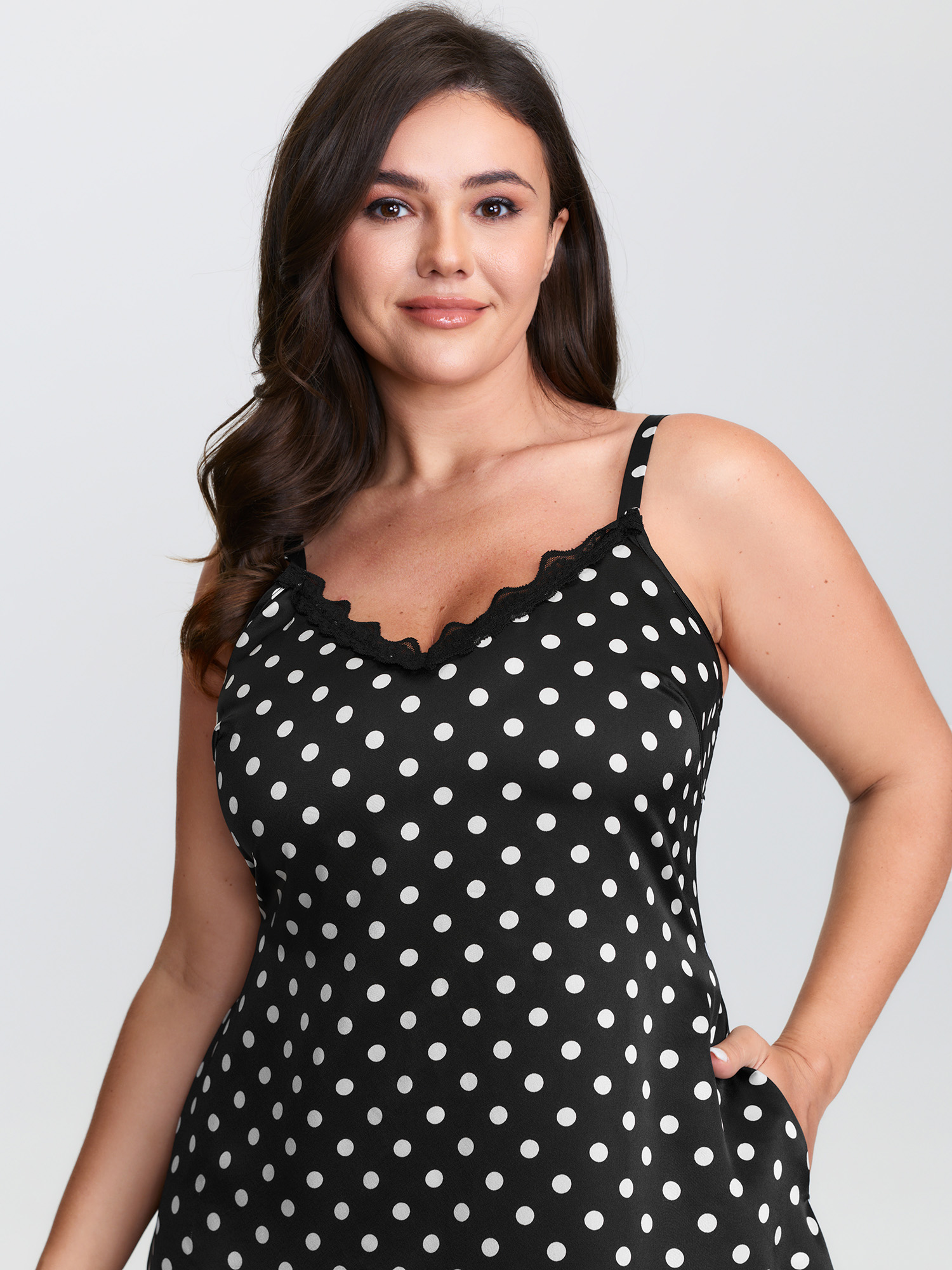 Side view of BloomChic Women's Plus Size Polka Dot Charm V-Neckline Nightgown Black Sleeveless Mini Deep V-Neck 14-16/1X