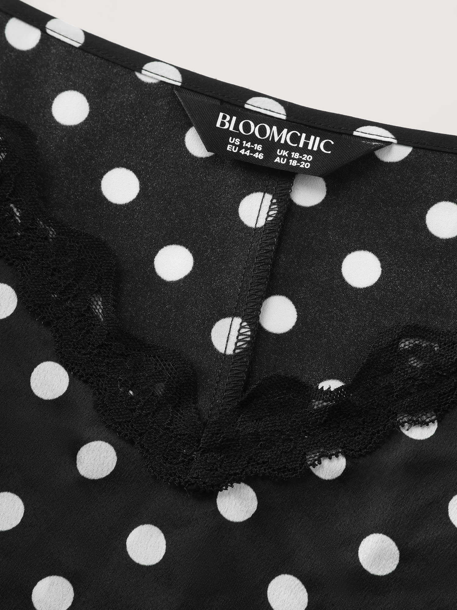 Side view of BloomChic Women's Plus Size Polka Dot Charm V-Neckline Nightgown Black Sleeveless Mini Deep V-Neck 14-16/1X
