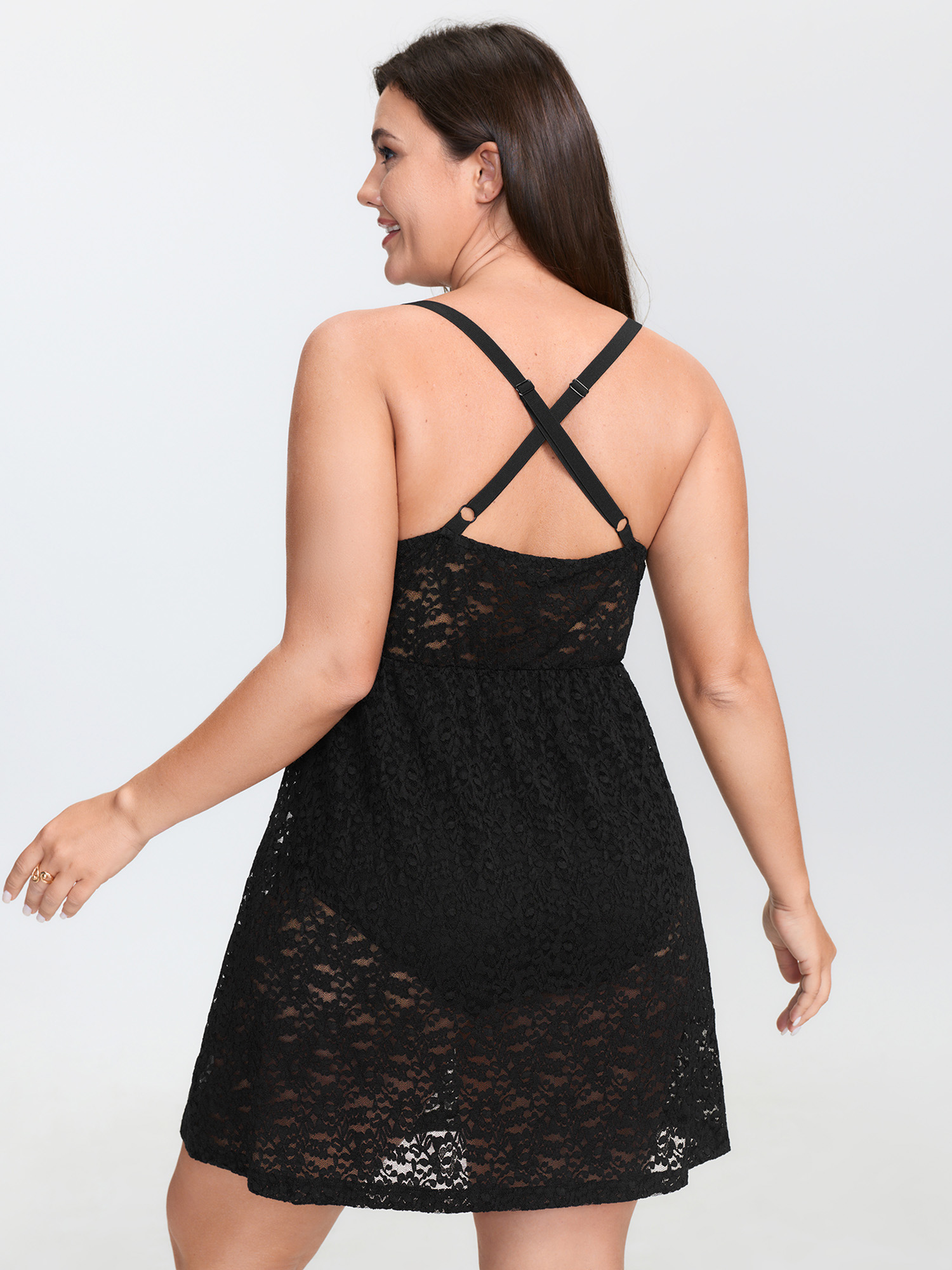 Side view of BloomChic Women's Plus Size Sheer Lace Textured Crosstie Nightgown Black Sleeveless Tunic 26/4X