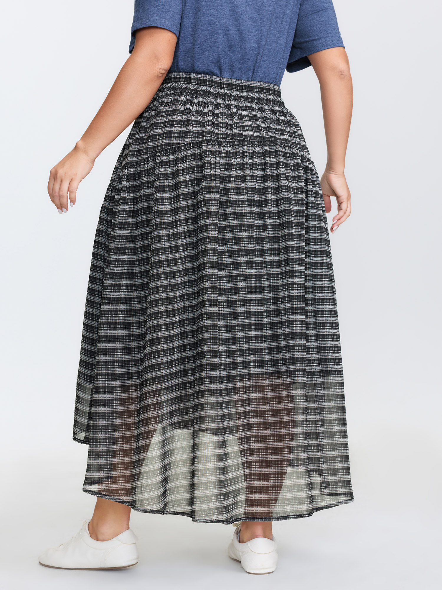Side view of BloomChic Women's Plus Size Checkered High-Low Hem Maxi Skirt Black Gathered Flared Casual 30/6X