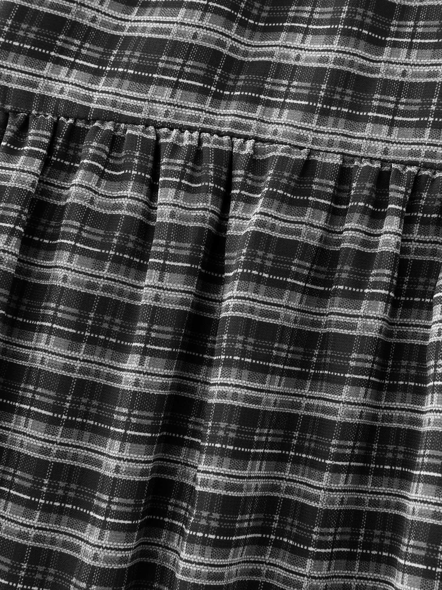 Side view of BloomChic Women's Plus Size Checkered High-Low Hem Maxi Skirt Black Gathered Flared Casual 30/6X