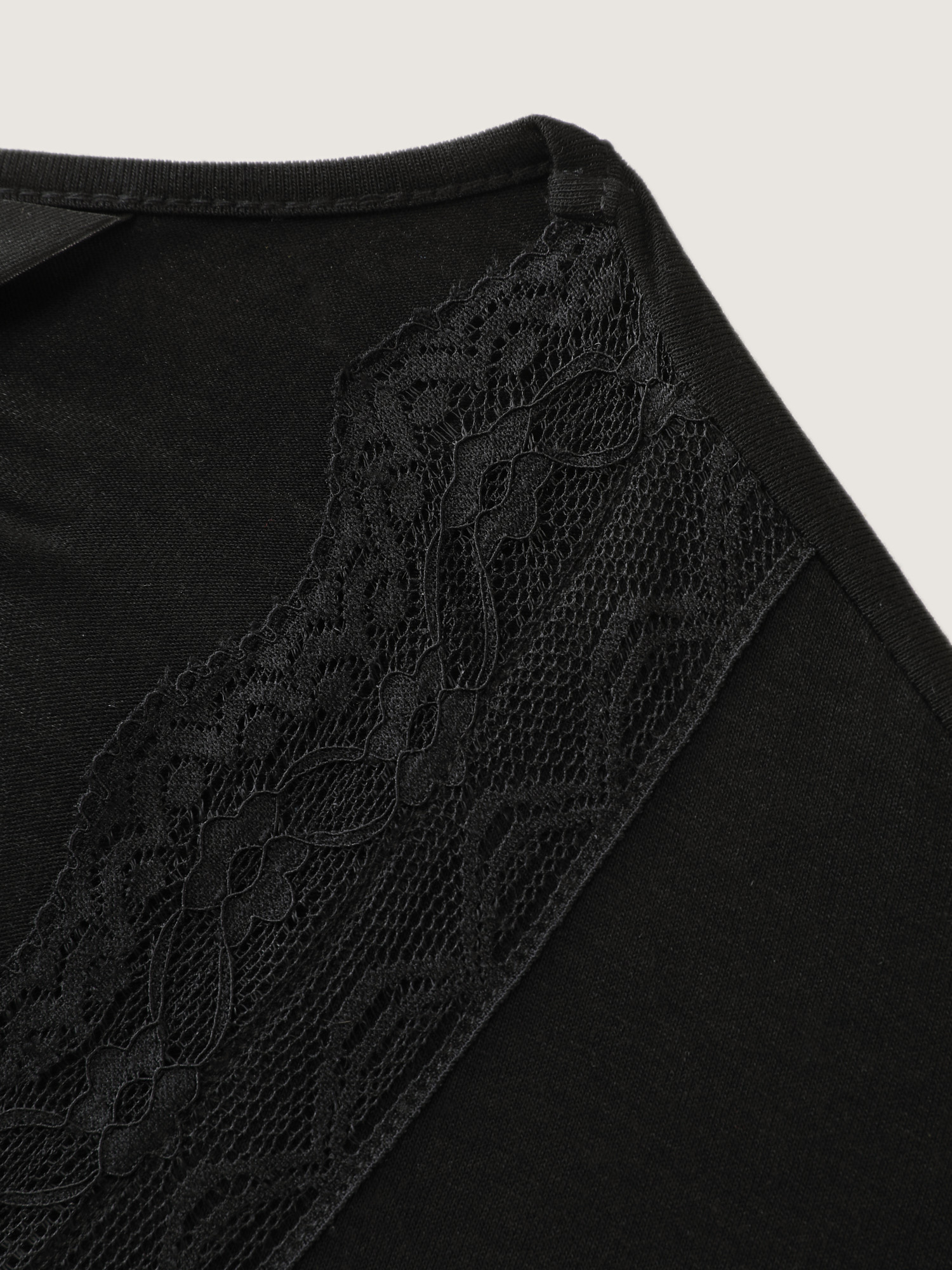 Side view of BloomChic Women's Plus Size Supersoft Lace Neckline Pajama Romper Pureblack Tunic 26/4X