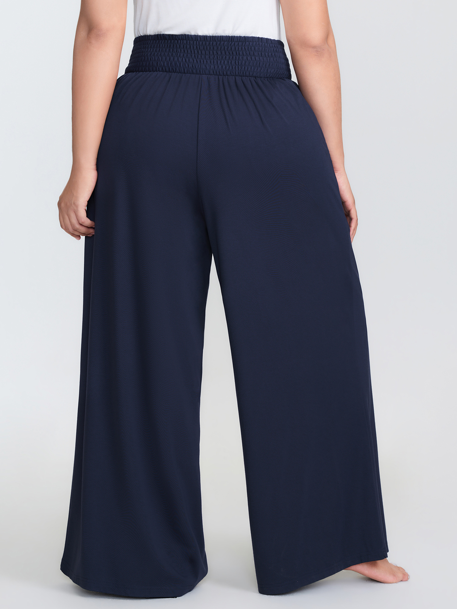 Side view of BloomChic Women's Plus Size Supersoft Shirred Wide Waistband Button Lounge Bottoms DarkBlue Knee 30/6X