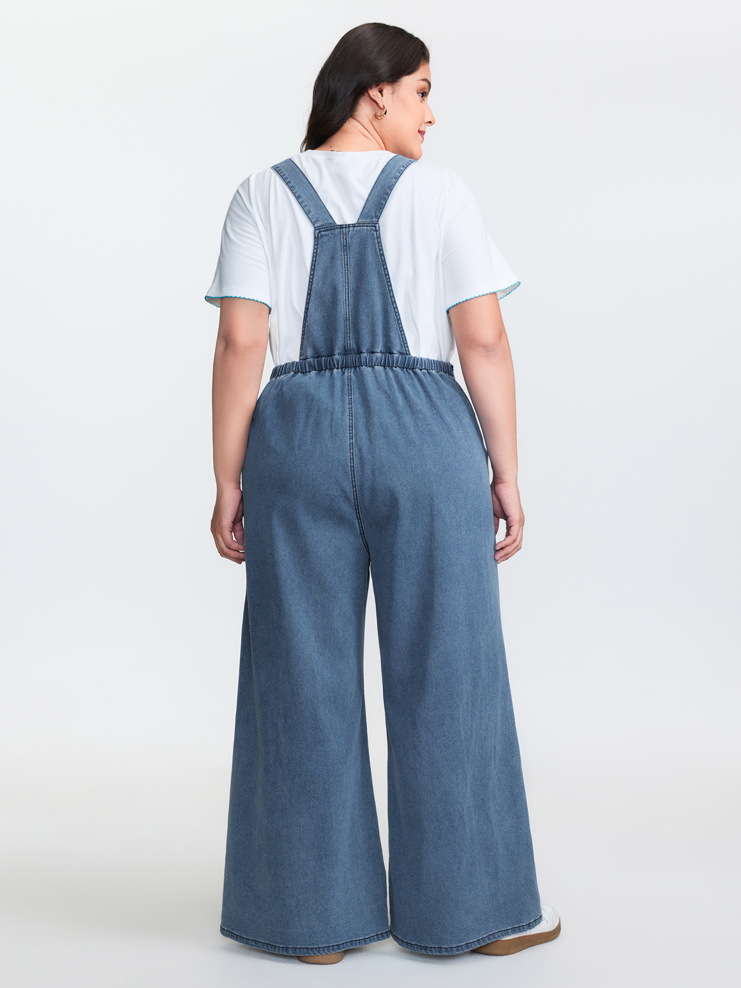 Side view of BloomChic Women's Plus Size Stretchy Relaxed-Fit Overall Wide-Leg Jumpsuit Midblue Casual Low stretch 26/4X