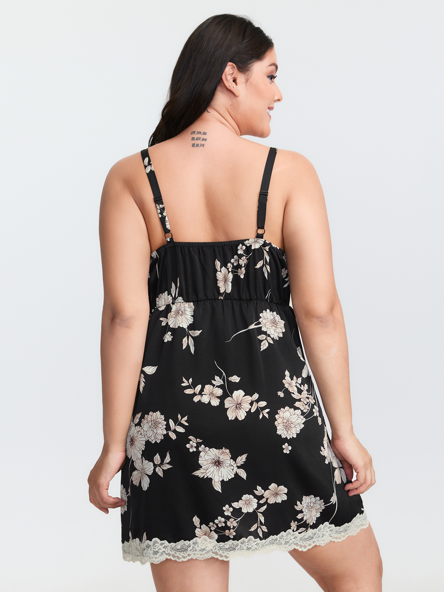 Side view of BloomChic Women's Plus Size Floral Print Deep Lace Neckline Nightgown Black Sleeveless Tunic 30/6X