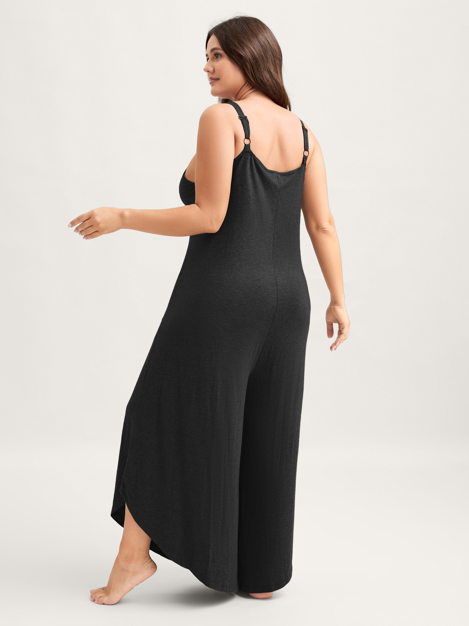 Side view of BloomChic Women's Plus Size Supersoft Wide-Leg Cami Lounge Jumpsuit Black not graphics Longline 30/6X