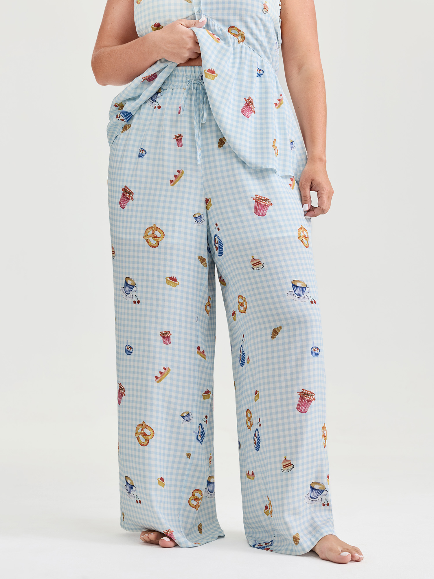 Side view of BloomChic Women's Plus Size Pretzel Coffee Print Drawstring Co-Ord Pajama Set LightBlue Plaid Sleeveless Tie knot 10/M