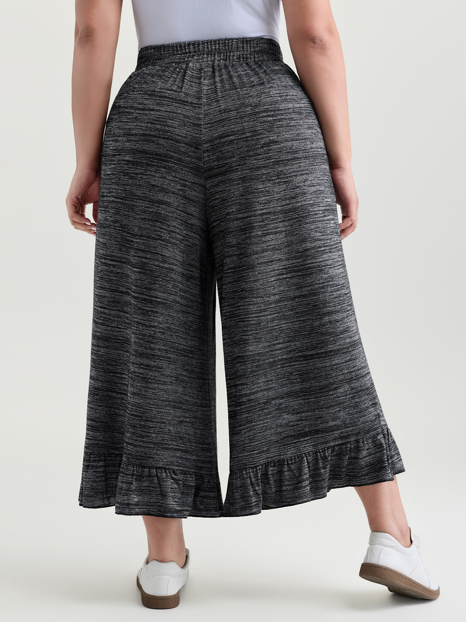 Side view of BloomChic Women's Plus Size Supersoft Ruffled Hem Wide-Leg Lounge Bottoms DimGray Ankle 28/5X