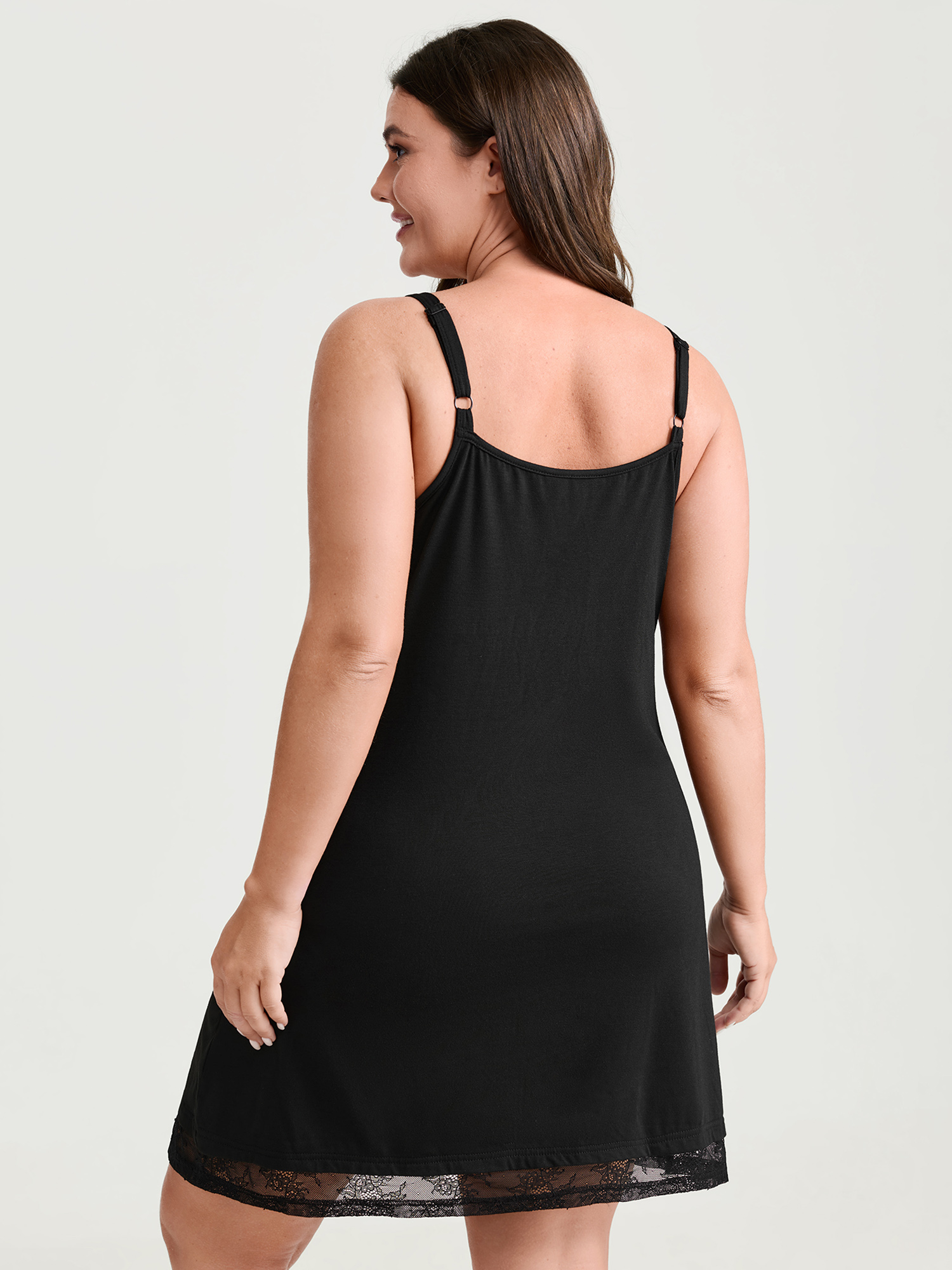 Side view of BloomChic Women's Plus Size Supersoft Sheer Neckline Pockets Nightgown Black Sleeveless Short 12/L