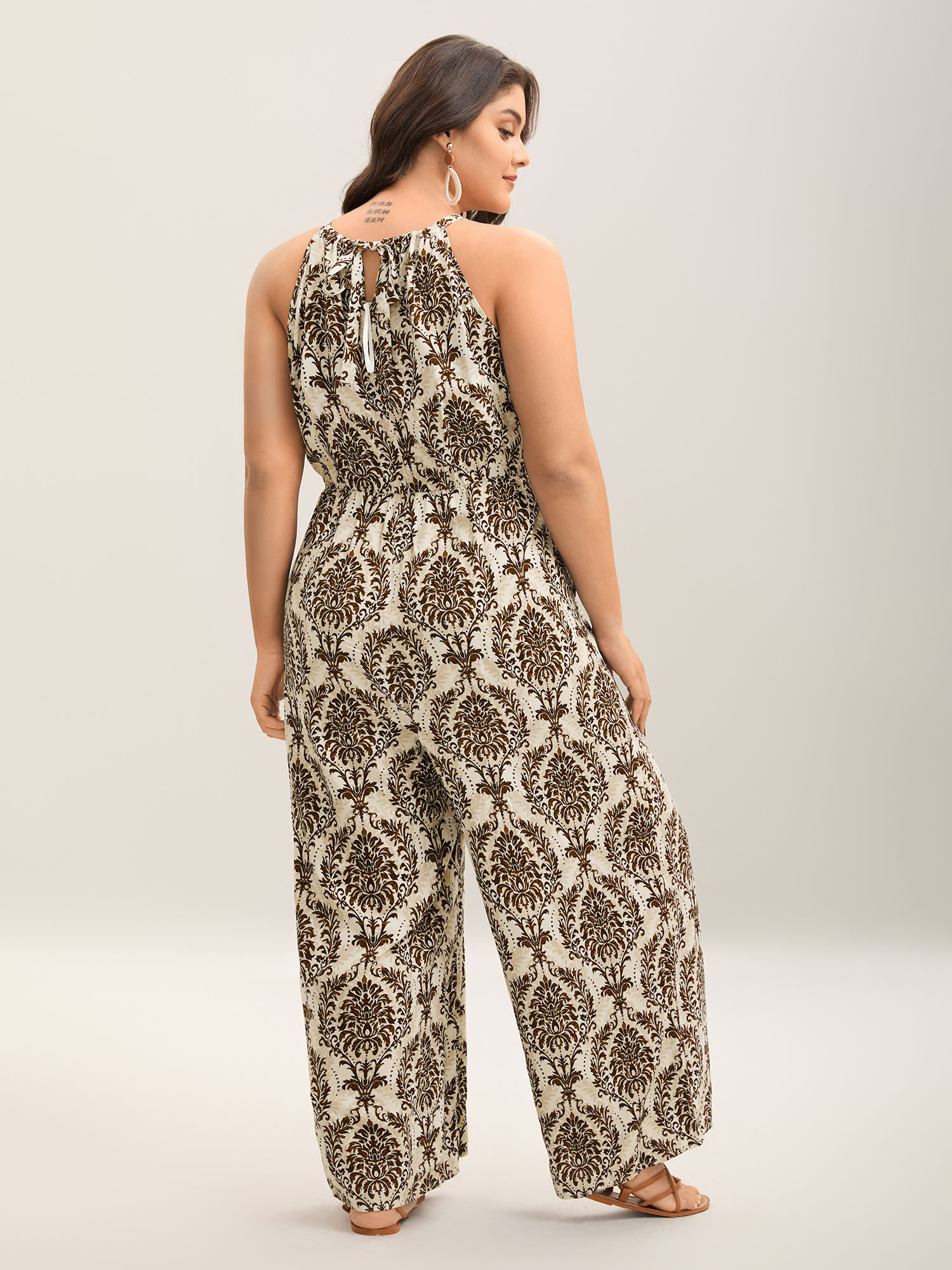 Side view of BloomChic Women's Plus Size Rayon Damask Print Stretchy Waist Jumpsuit Browncoffeecolor Vacation 30/6X