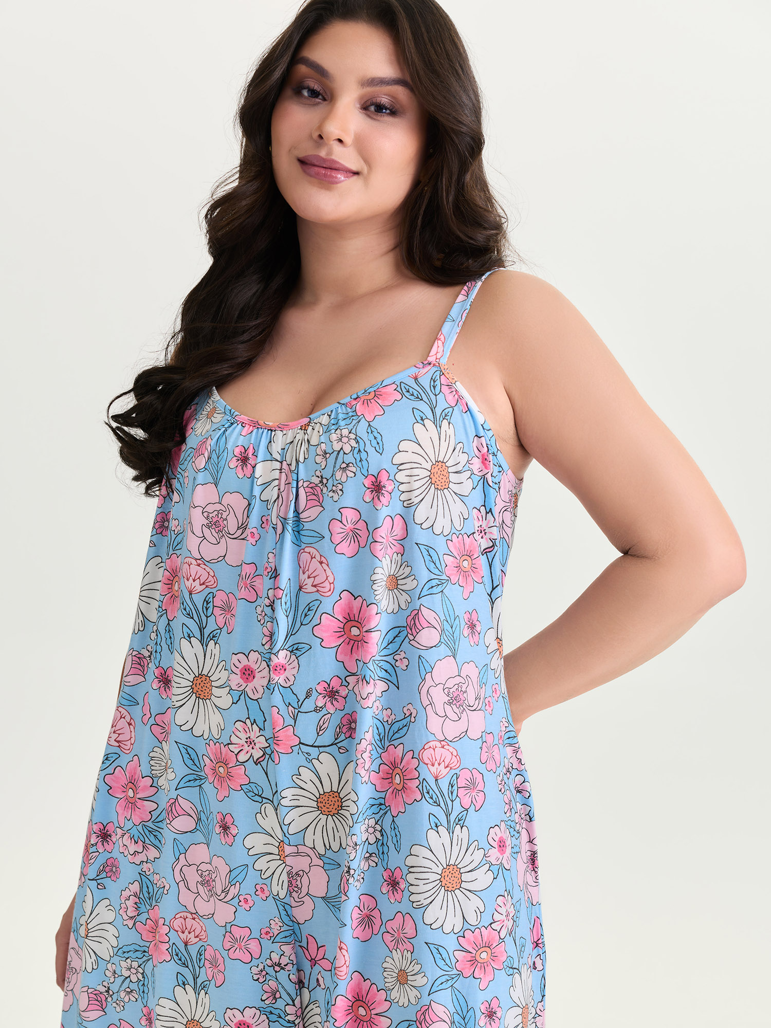 Side view of BloomChic Women's Plus Size Stretchy Floral Print Wide Straps Jumpsuit LightBlue Casual 30/6X
