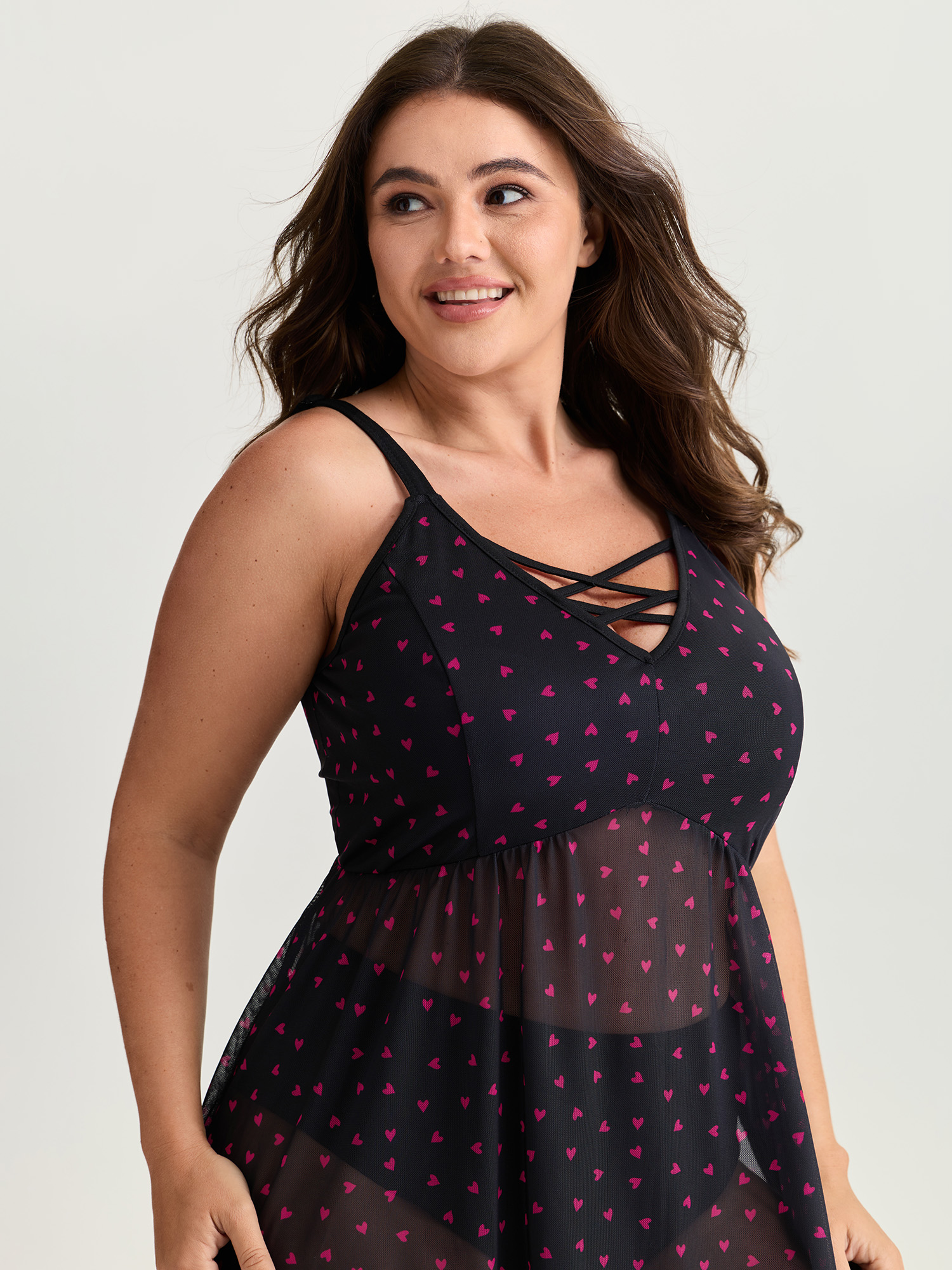 Side view of BloomChic Women's Plus Size Sweetheart Print Sheer Crisscross Neckline Nightgown Black Sleeveless Tunic 12/L