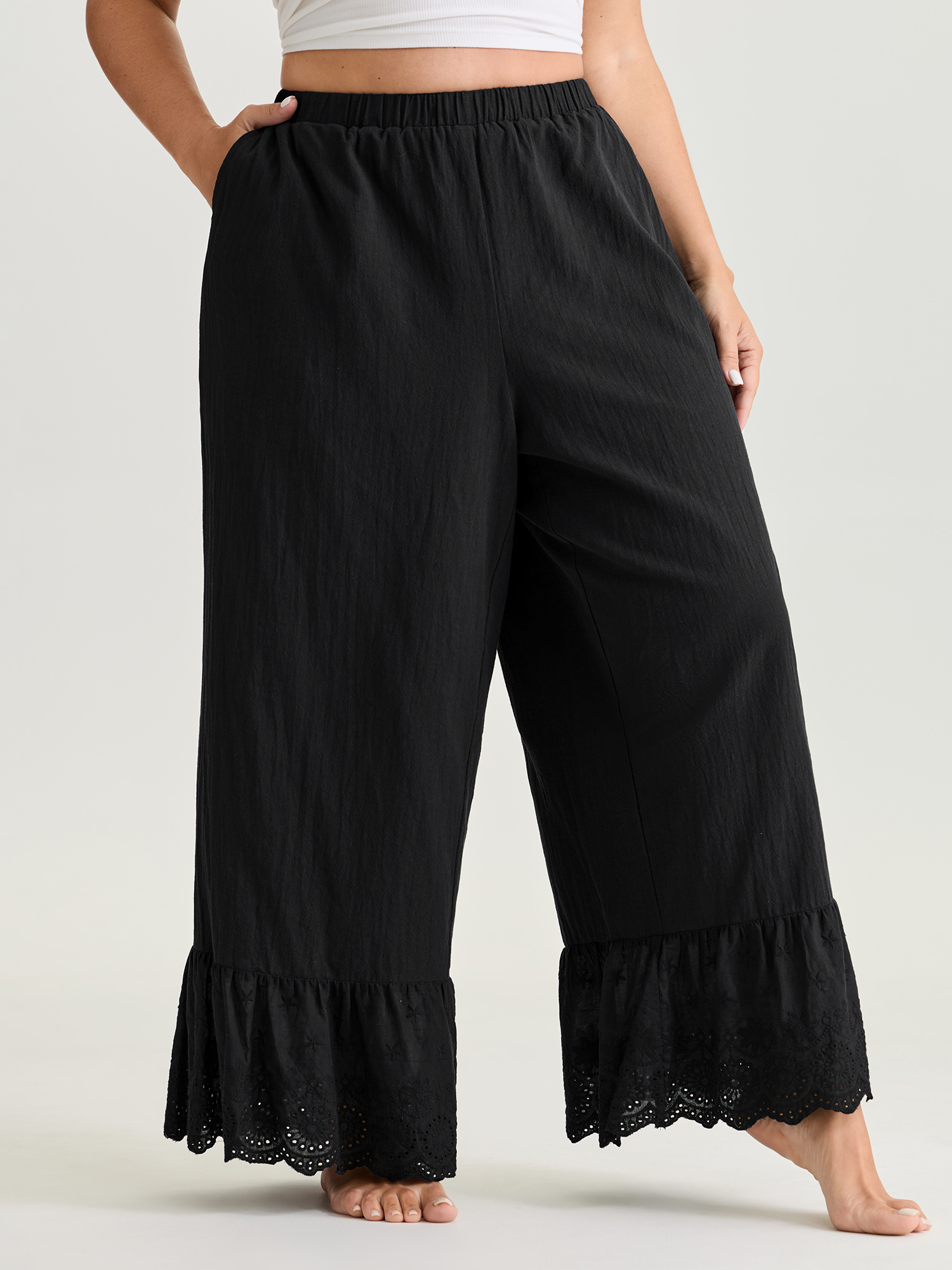 Side view of BloomChic Women's Plus Size Pure Cotton Ruffled Hem Lounge Bottoms Black Full 22-24/3X