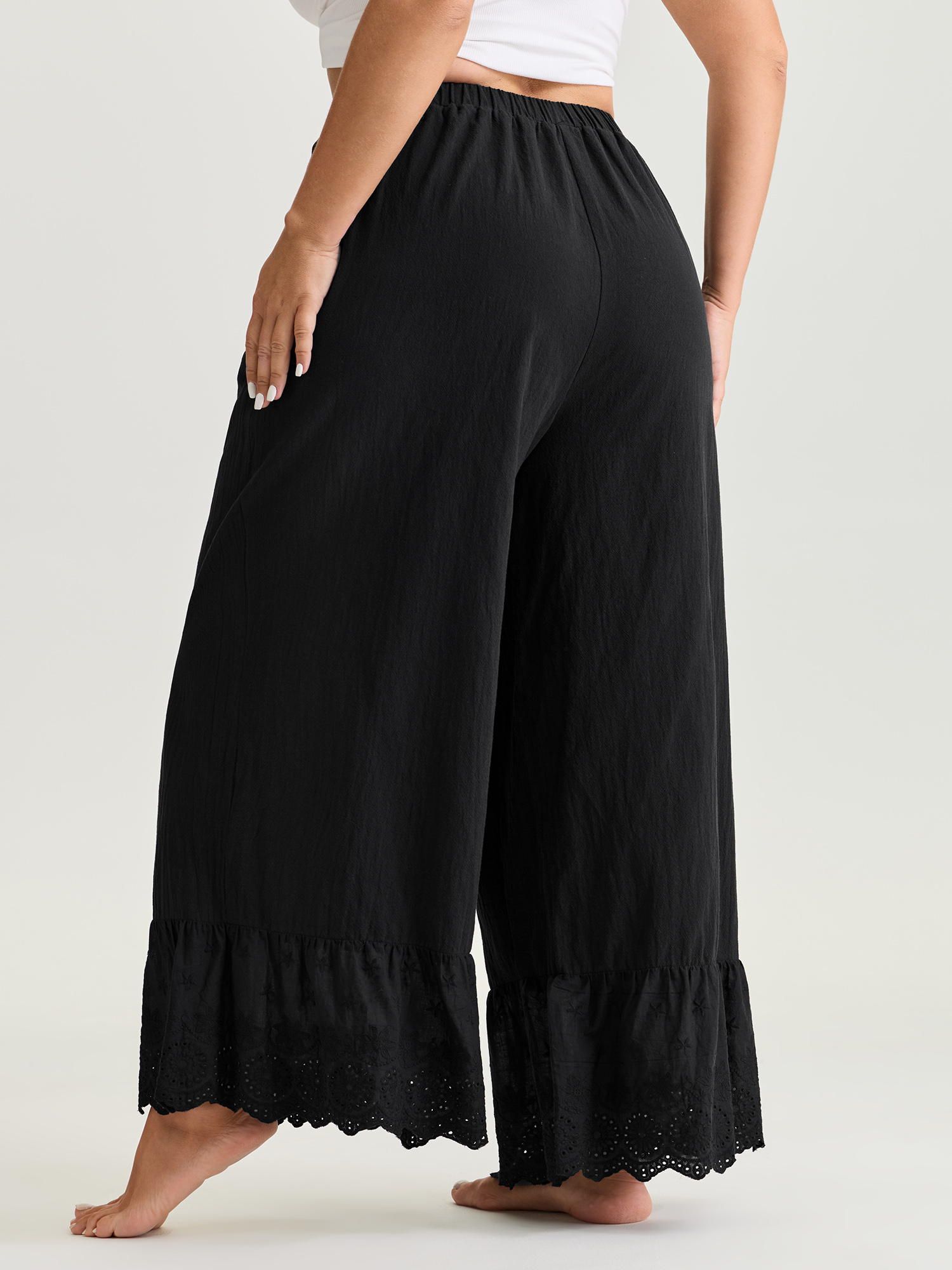 Side view of BloomChic Women's Plus Size Pure Cotton Ruffled Hem Lounge Bottoms Black Full 22-24/3X