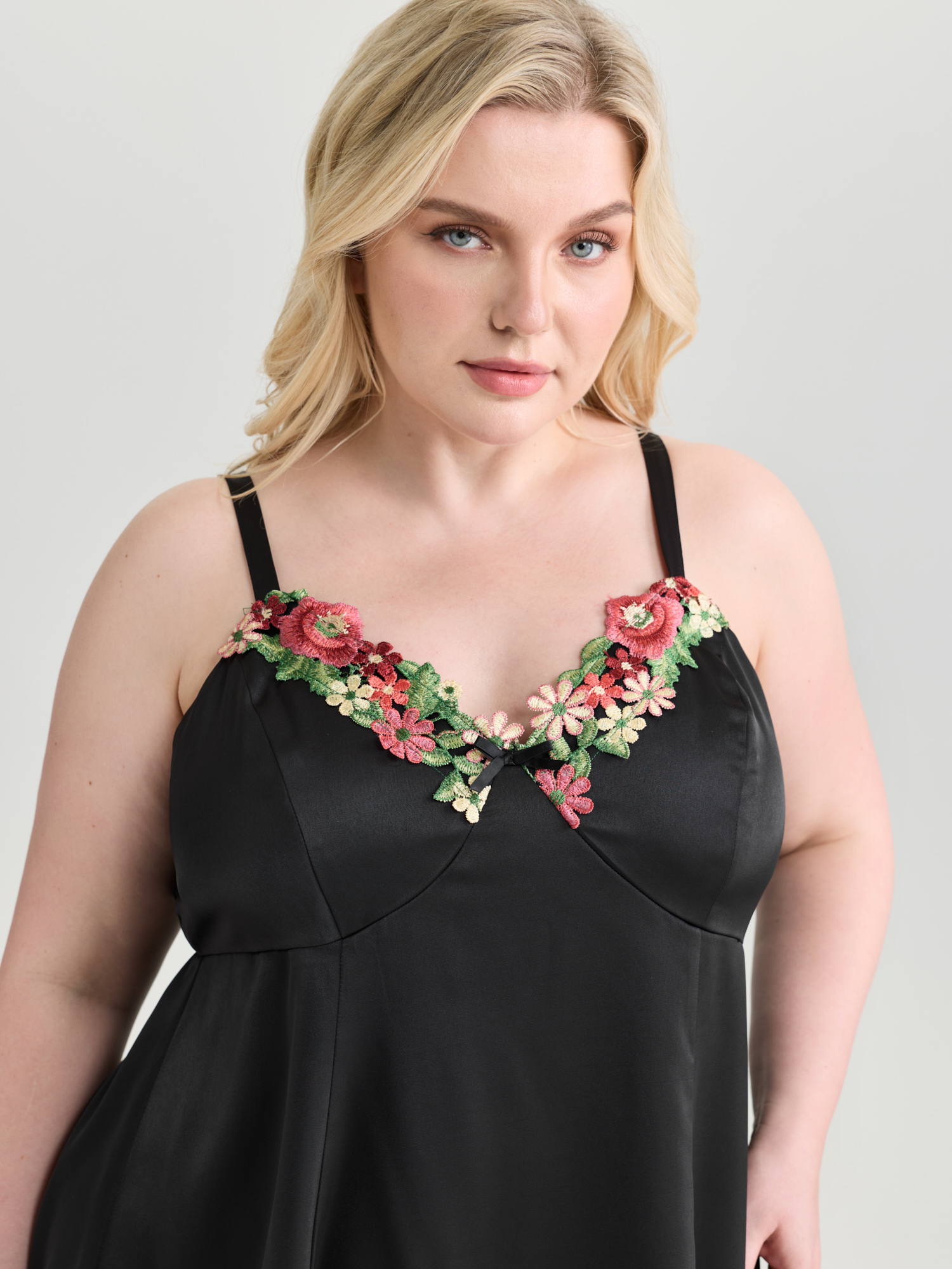 Side view of BloomChic Women's Plus Size Floral Embroidered Satin Bustier Nightgown Black Sleeveless Tunic 14-16/1X