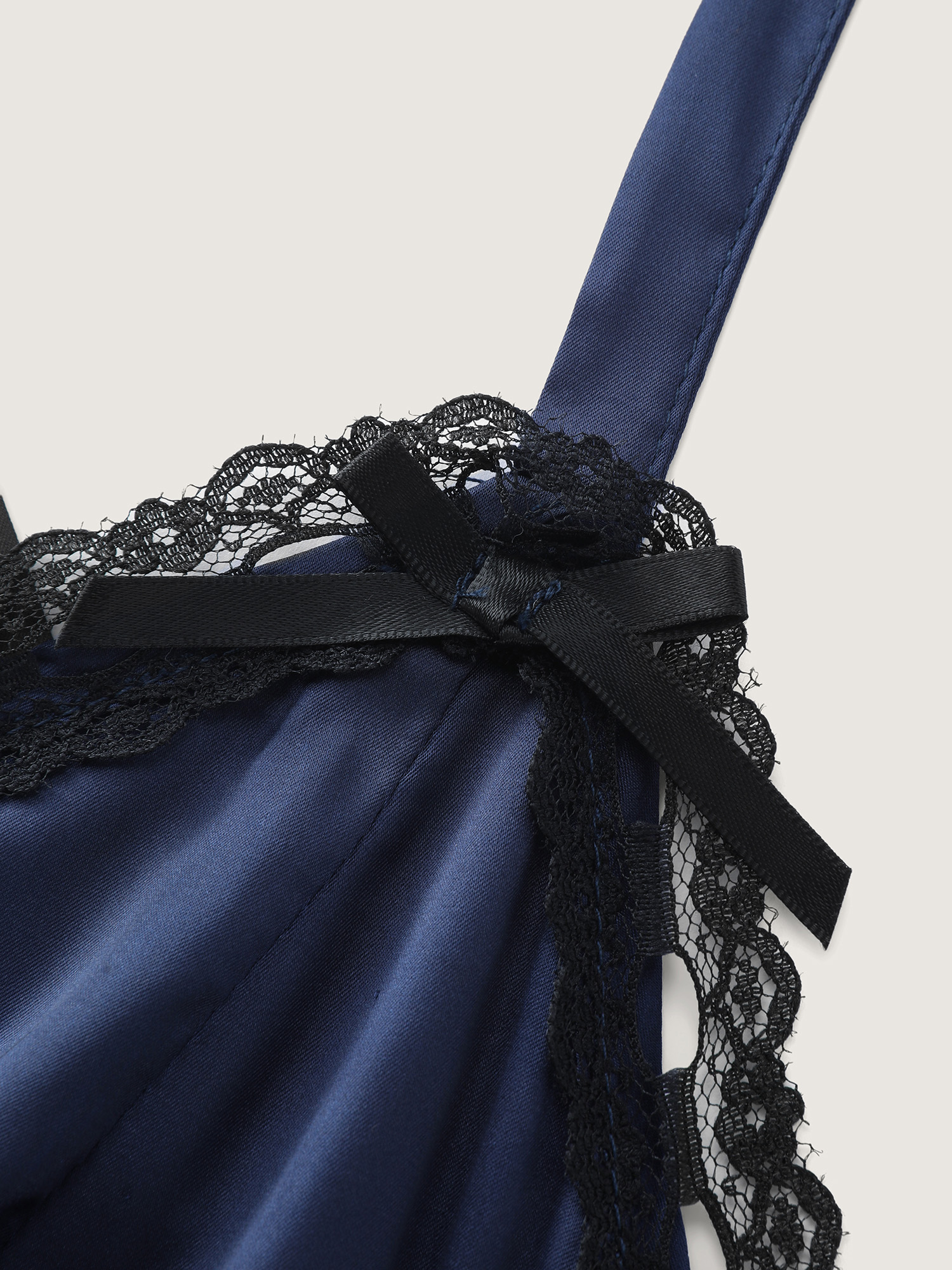 Side view of BloomChic Women's Plus Size Satin Lace Trim Plunging Neckline Nightgown Indigo Sleeveless cropped V-Neck 12/L