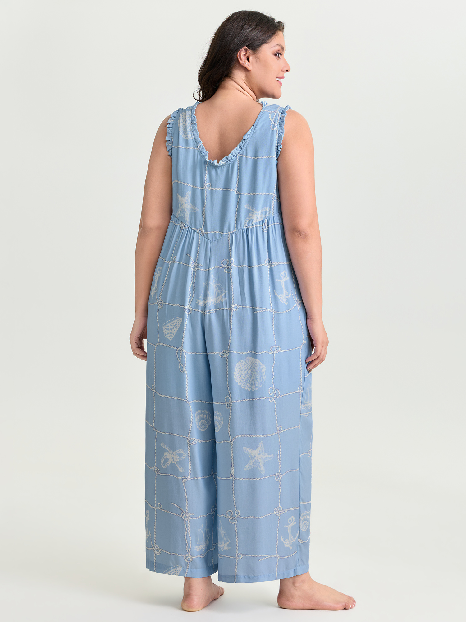 Side view of BloomChic Women's Plus Size Seashell Print Button Placket Lounge Jumpsuit LightBlue not graphics Maxi 26/4X