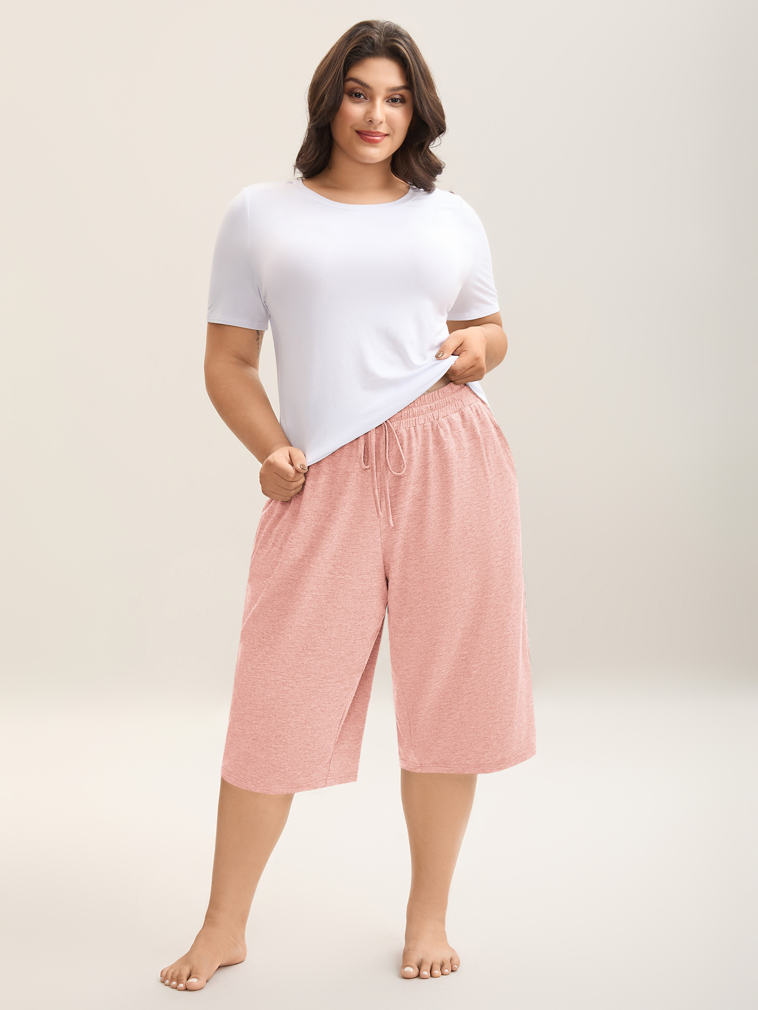 Side view of BloomChic Women's Plus Size Mixed Color Knit Drawstring Loungewear Bottoms Nudepink Knee Length 18-20/2X