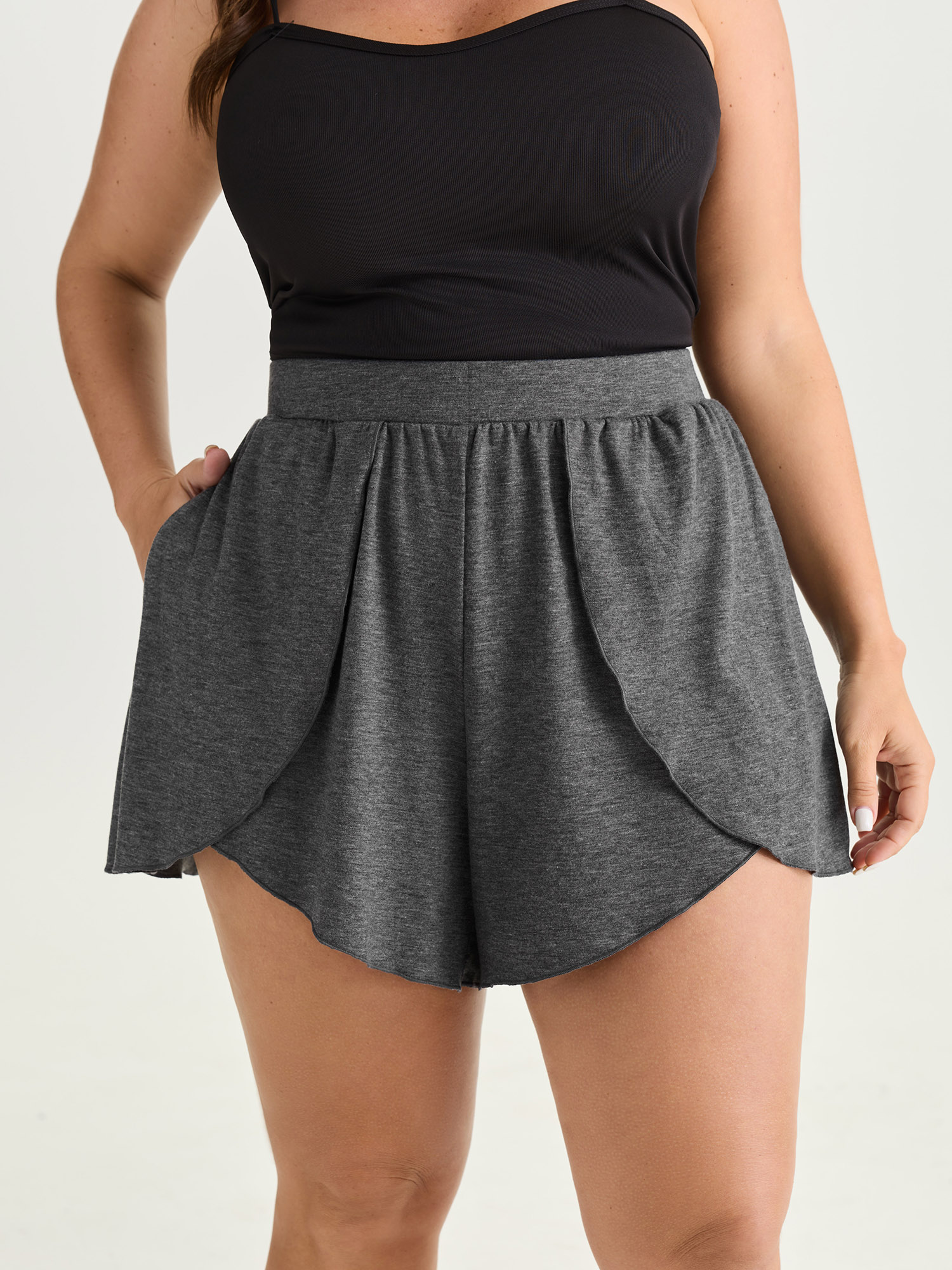 Side view of BloomChic Women's Plus Size Supersoft Stretchy Petal Hem Lounge Bottoms DimGray short 22-24/3X