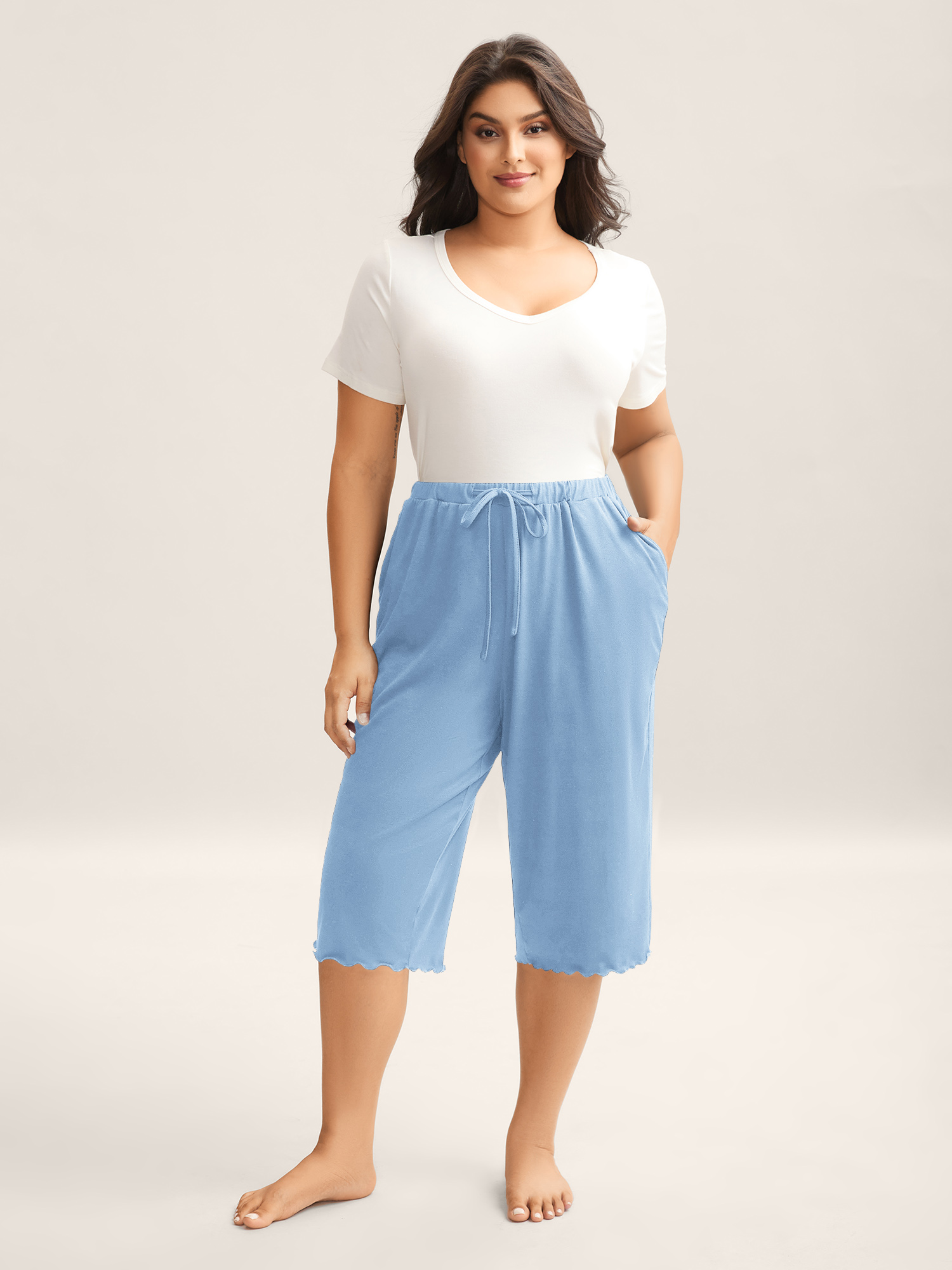 Side view of BloomChic Women's Plus Size Supersoft Scalloped Hem Straight-Fit Lounge Bottoms LightBlue Knee Length 10/M