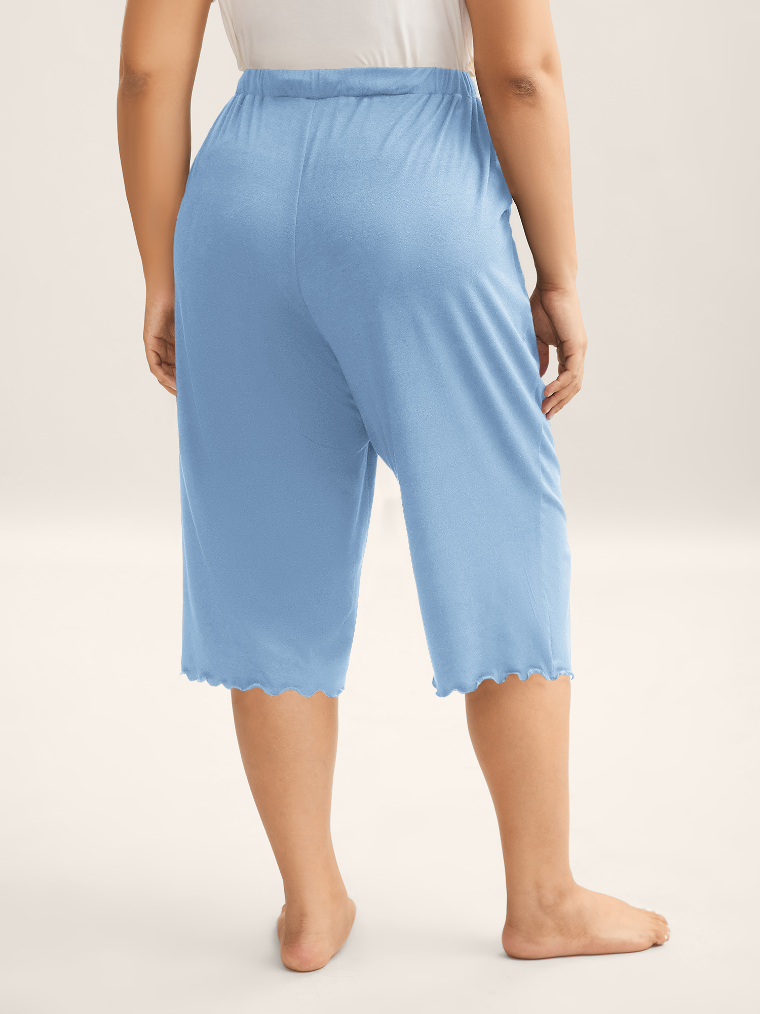 Side view of BloomChic Women's Plus Size Supersoft Scalloped Hem Straight-Fit Lounge Bottoms LightBlue Knee Length 10/M