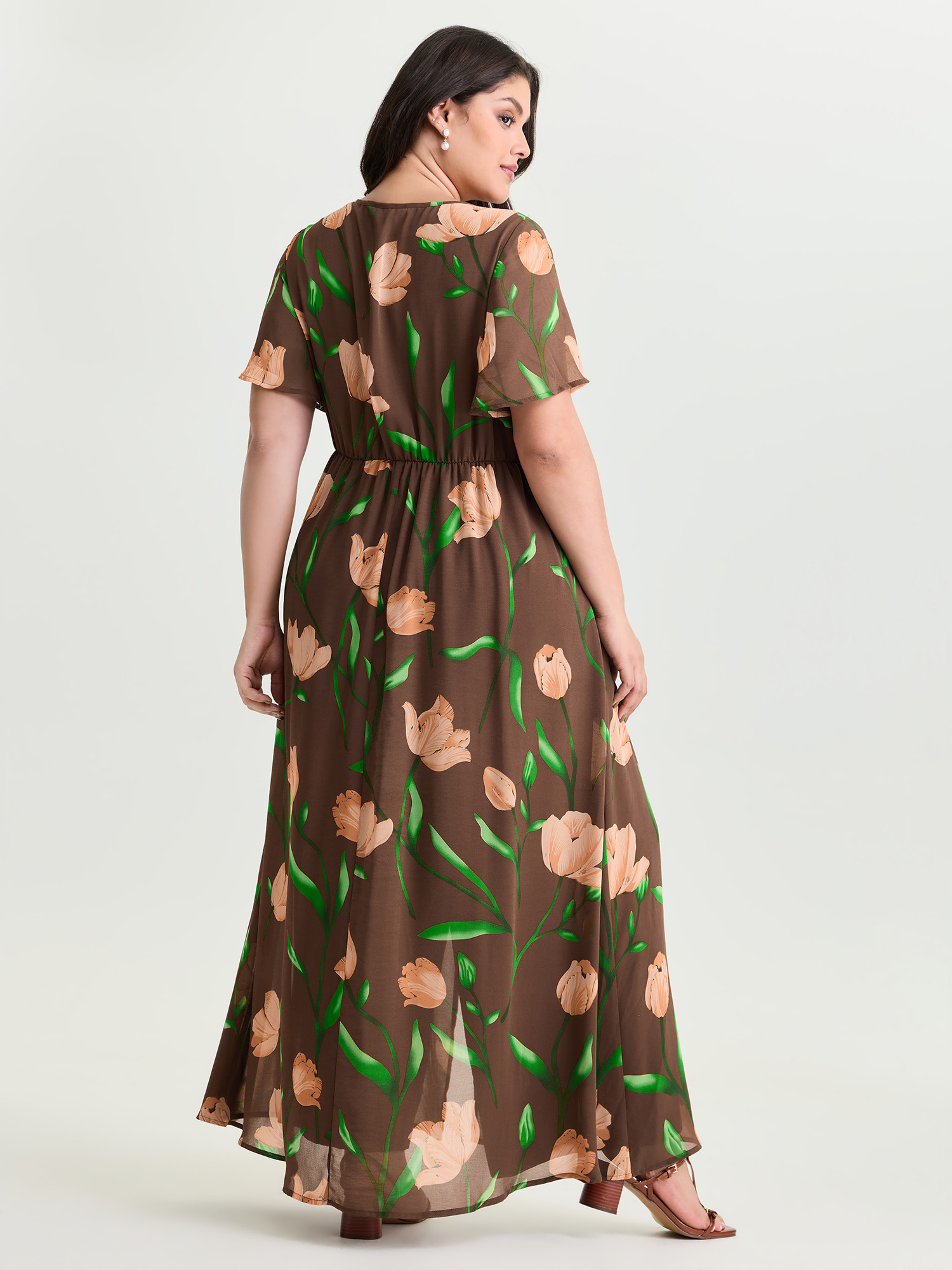 Side view of BloomChic Women's Plus Size Hidden Zipper Floral Layered Pockets Jumpsuit DarkBrown Elegant 30/6X