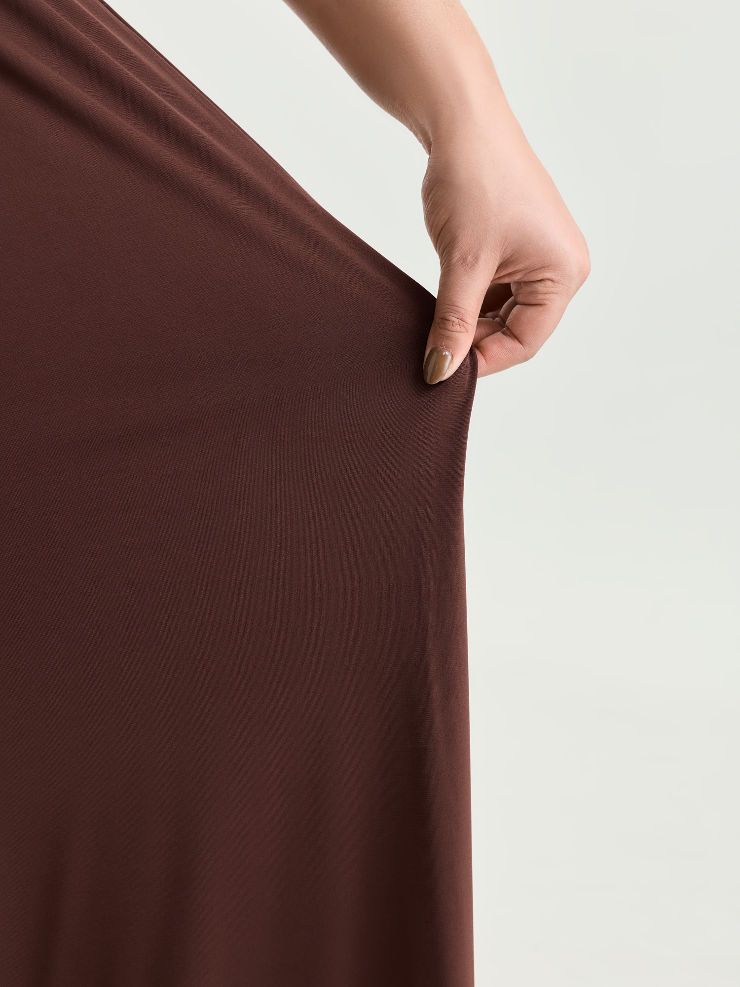 Side view of BloomChic Women's Plus Size Supersoft Stretchy Pleated Flared Plain Pants Browncoffeecolor Solid Flared Mid Rise Elegant 30/6X