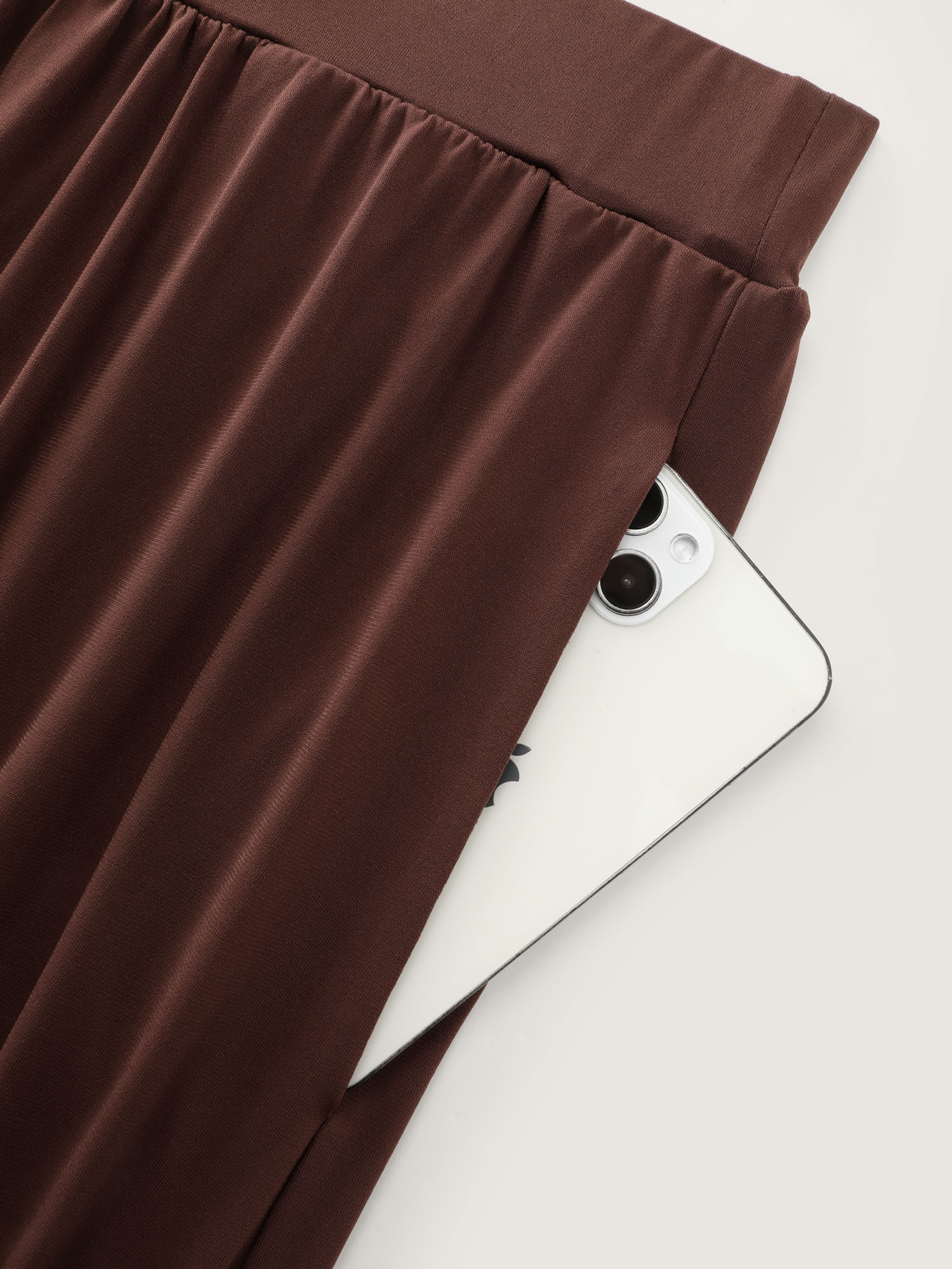 Side view of BloomChic Women's Plus Size Supersoft Stretchy Pleated Flared Plain Pants Browncoffeecolor Solid Flared Mid Rise Elegant 30/6X