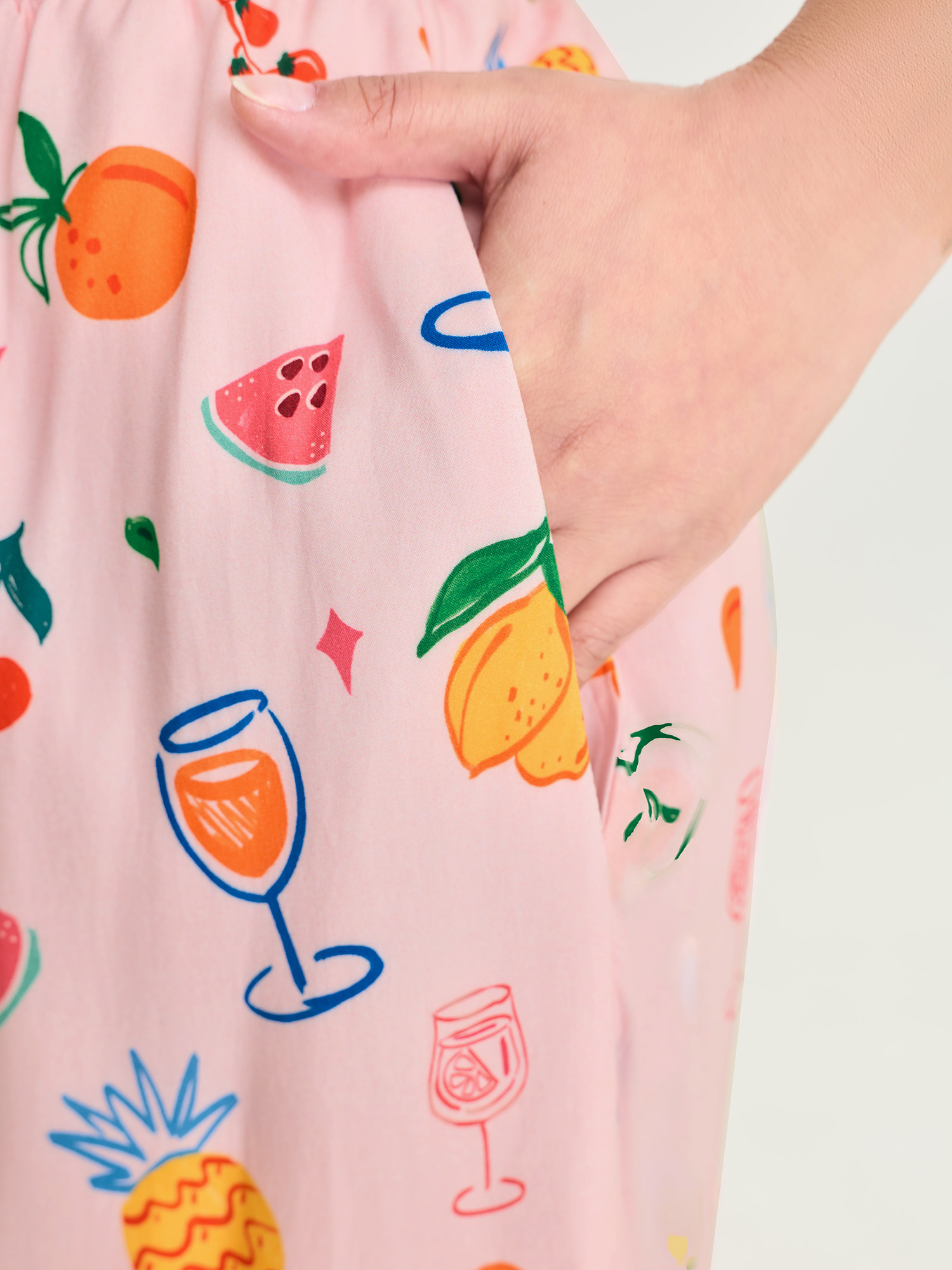 Side view of BloomChic Women's Plus Size Supersoft Playful Print Drawstring Pajama Bottoms Multicolor Fruit Lace-Up 26/4X