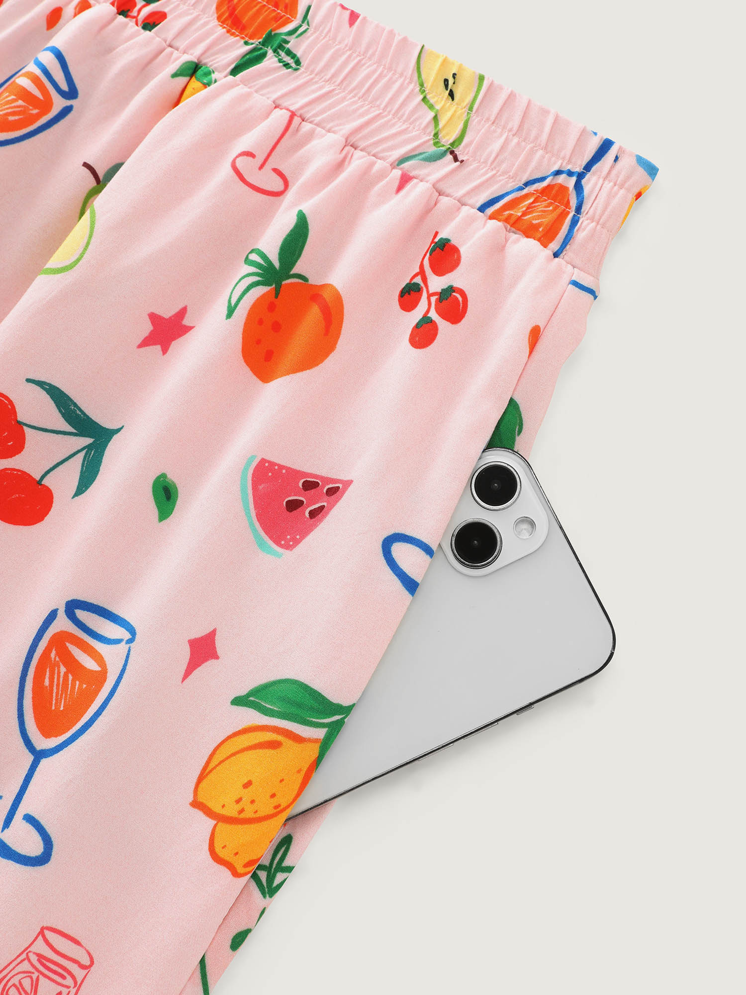 Side view of BloomChic Women's Plus Size Supersoft Playful Print Drawstring Pajama Bottoms Multicolor Fruit Lace-Up 26/4X