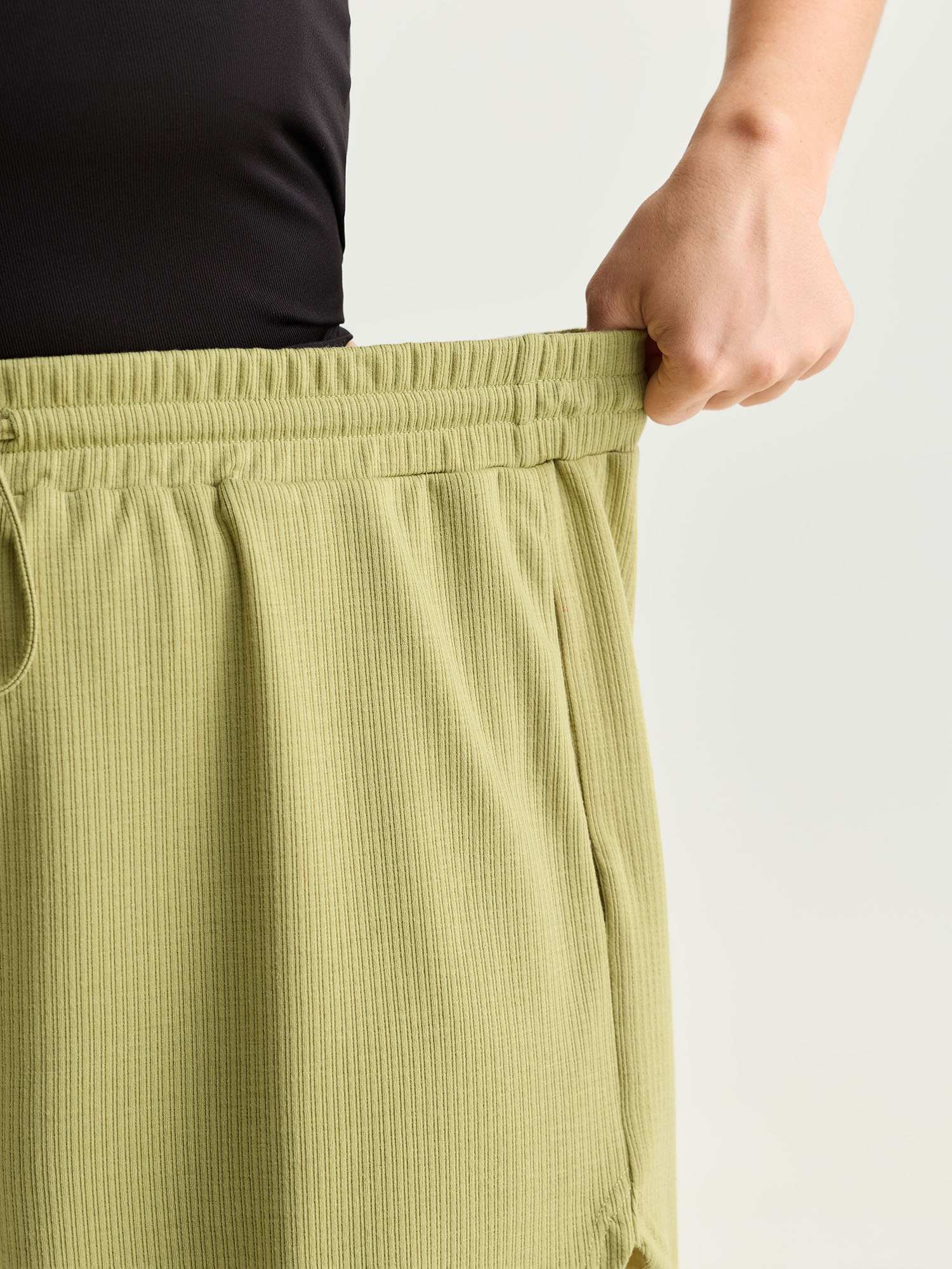 Side view of BloomChic Women's Plus Size Supersoft Stretchy Textured Drawstring Lounge Bottoms Mustardyellow short 28/5X