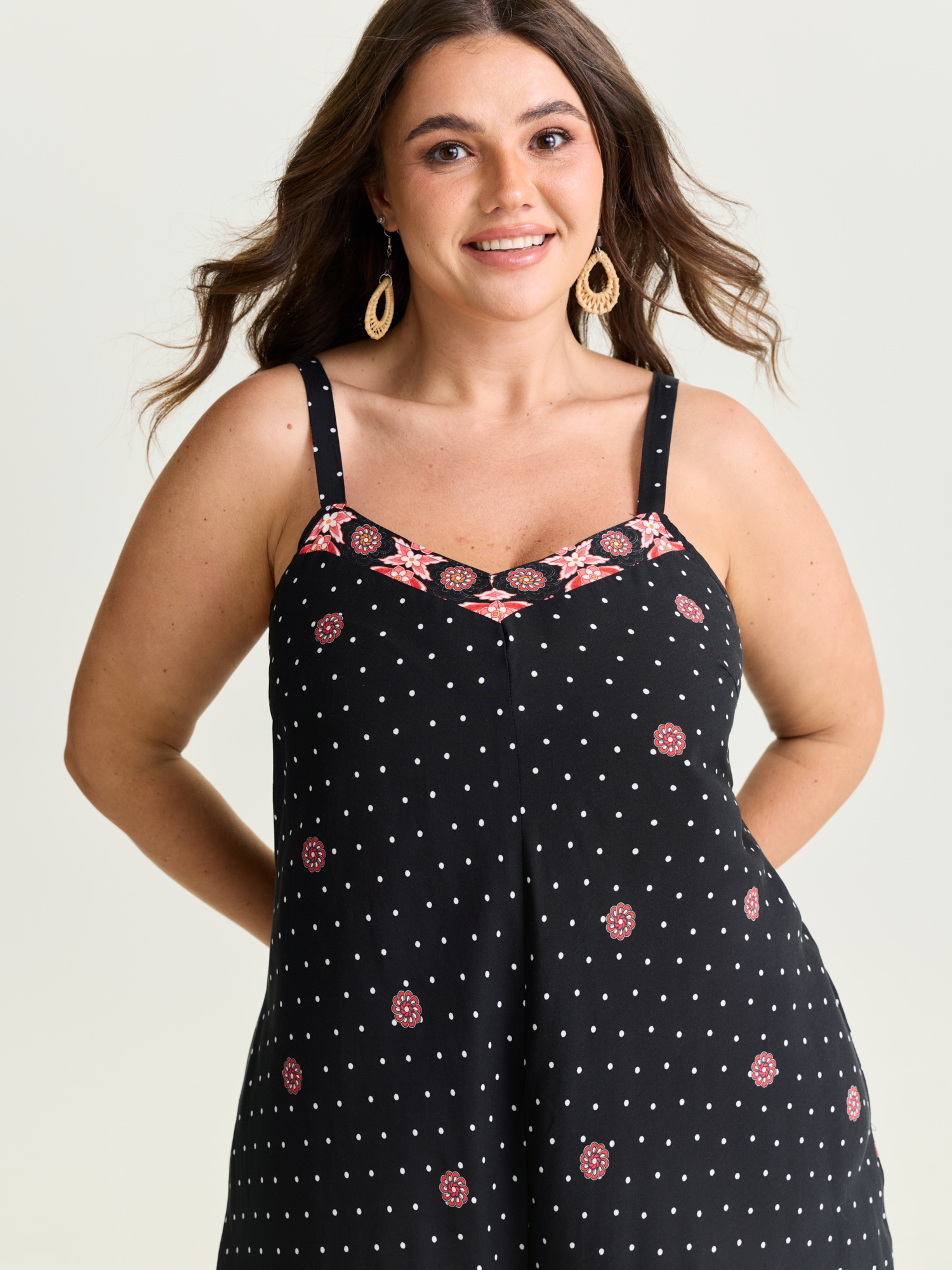 Side view of BloomChic Women's Plus Size Boho Print Asymmetrical Hem Jumpsuit Multicolor Vacation 22-24/3X