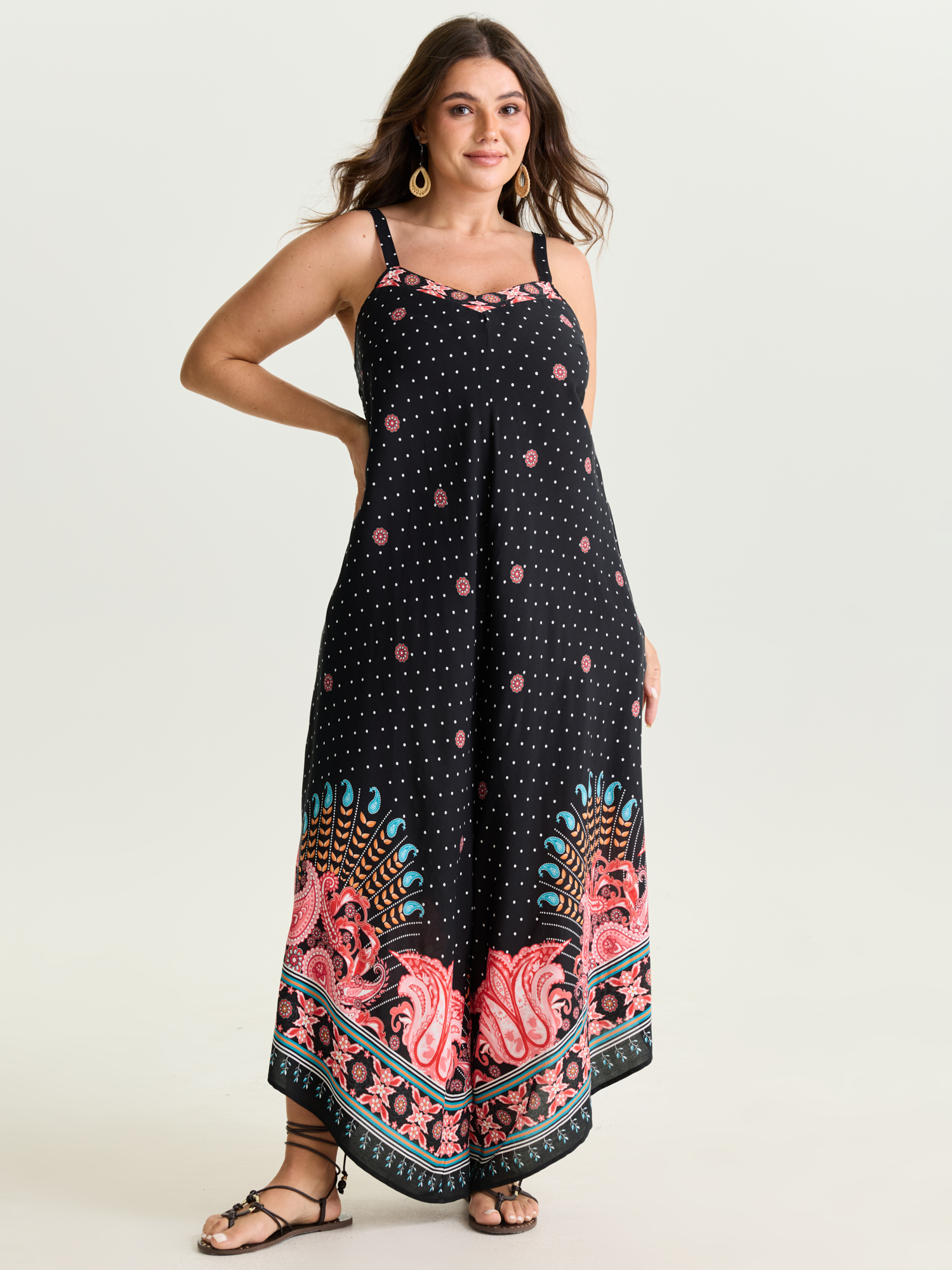 Side view of BloomChic Women's Plus Size Boho Print Asymmetrical Hem Jumpsuit Multicolor Vacation 22-24/3X